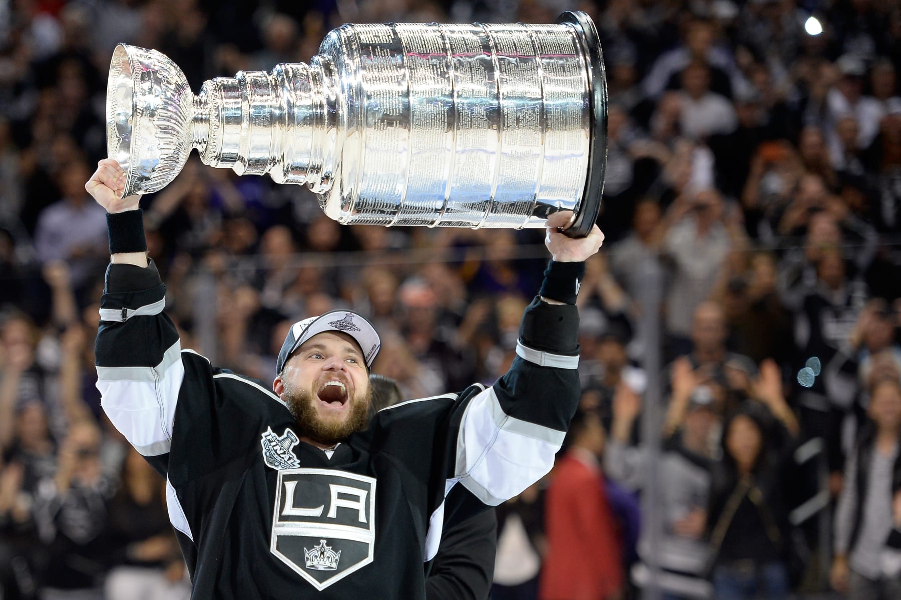LOS ANGELES, CA - JUNE 13:  Marian Gaborik #12 of the Los Angeles Kings hoists the Stanley Cup in celebration after defeating the New York Rangers 3-2 in double overtime of Game Five of the 2014 Stanley Cup Final at Staples Center on June 13, 2014 in Los Angeles, California.  (Photo by Harry How/Getty Images) 