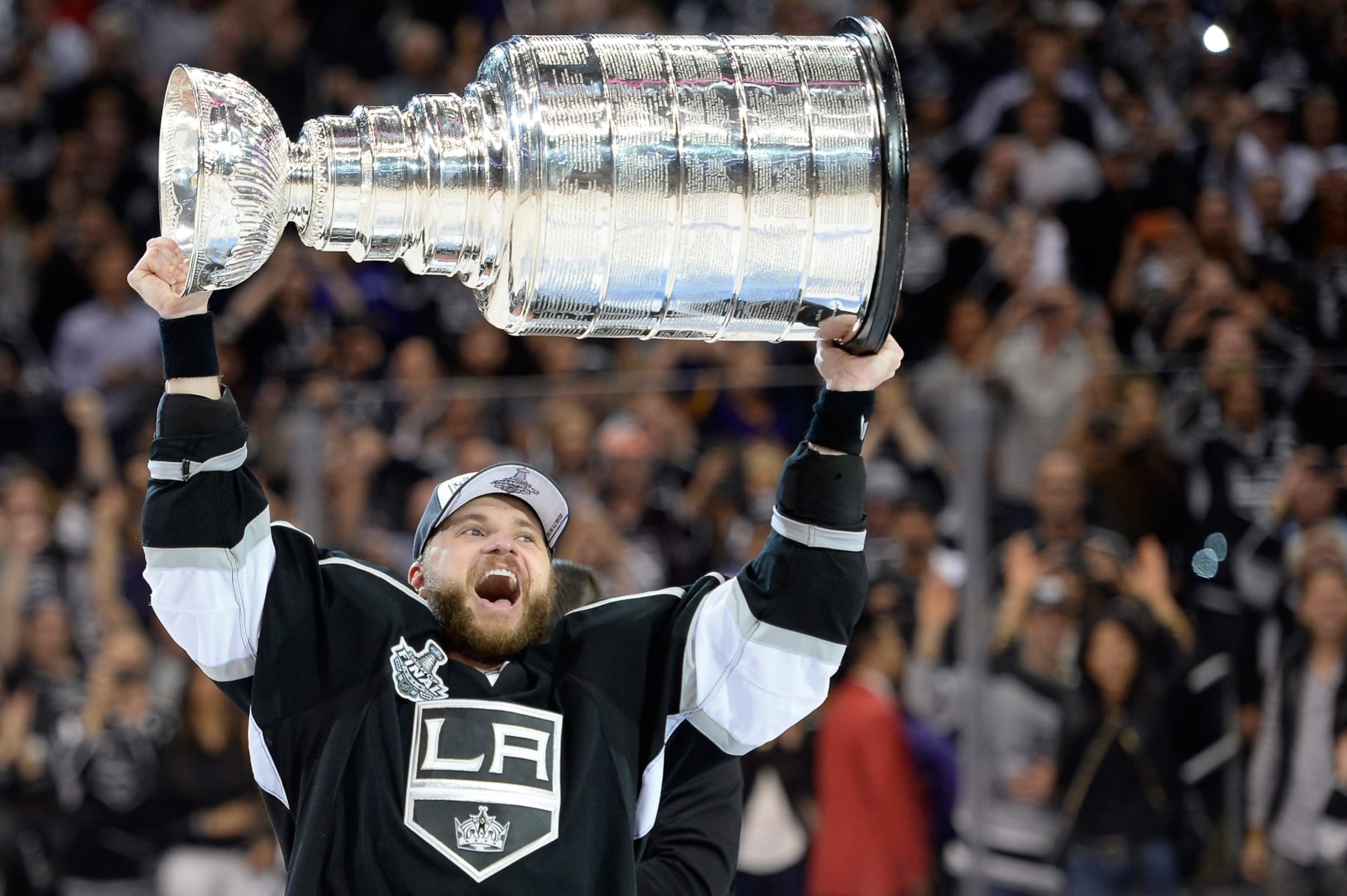 LOS ANGELES, CA - JUNE 13:  Marian Gaborik #12 of the Los Angeles Kings hoists the Stanley Cup in celebration after defeating the New York Rangers 3-2 in double overtime of Game Five of the 2014 Stanley Cup Final at Staples Center on June 13, 2014 in Los Angeles, California.  (Photo by Harry How/Getty Images) 