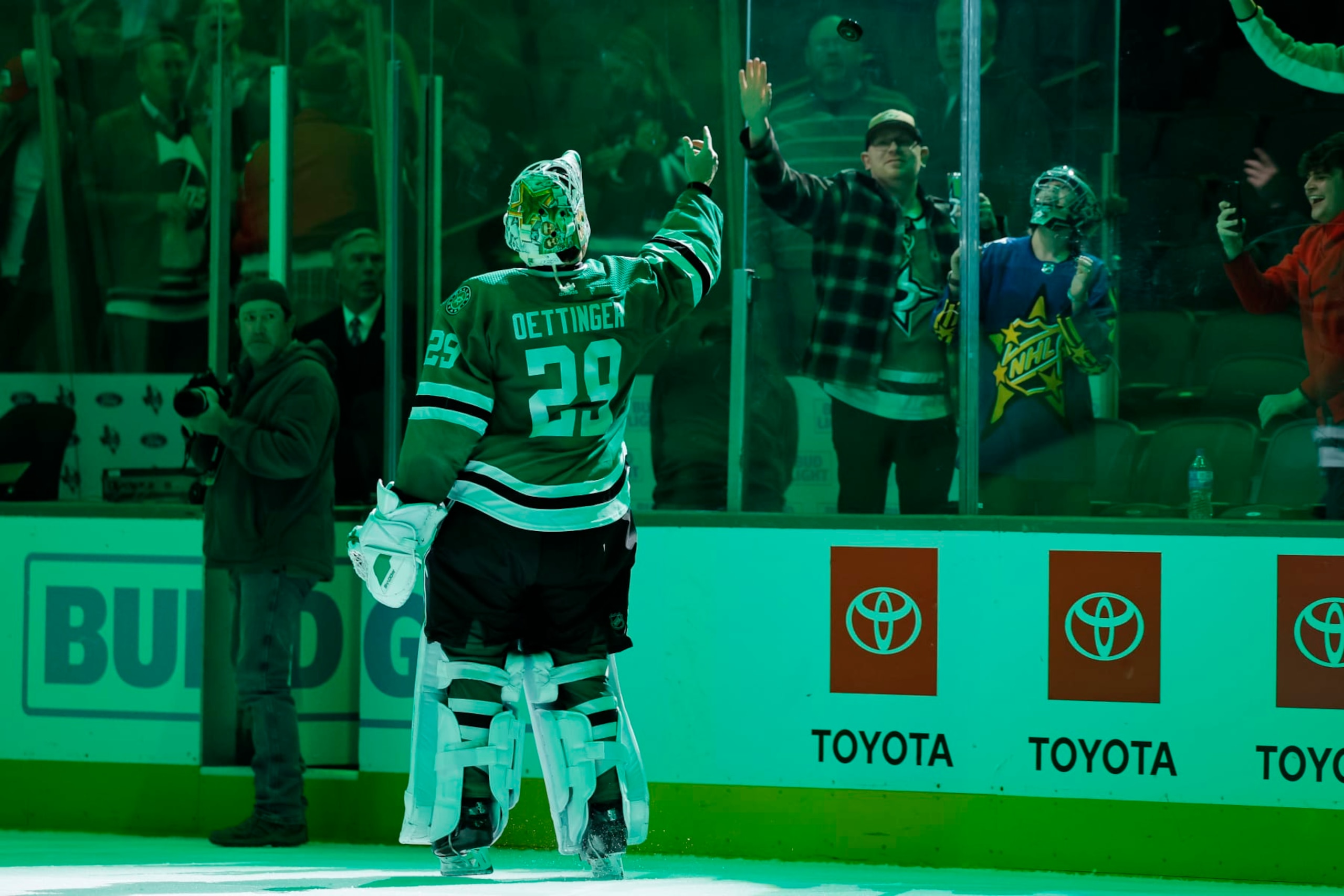 DALLAS, TEXAS - FEBRUARY 29: Jake Oettinger #29 of the Dallas Stars tosses a puck into the stands after the game against the Winnipeg Jets at American Airlines Center on February 29, 2024 in Dallas, Texas. (Photo by Sam Hodde/Getty Images)