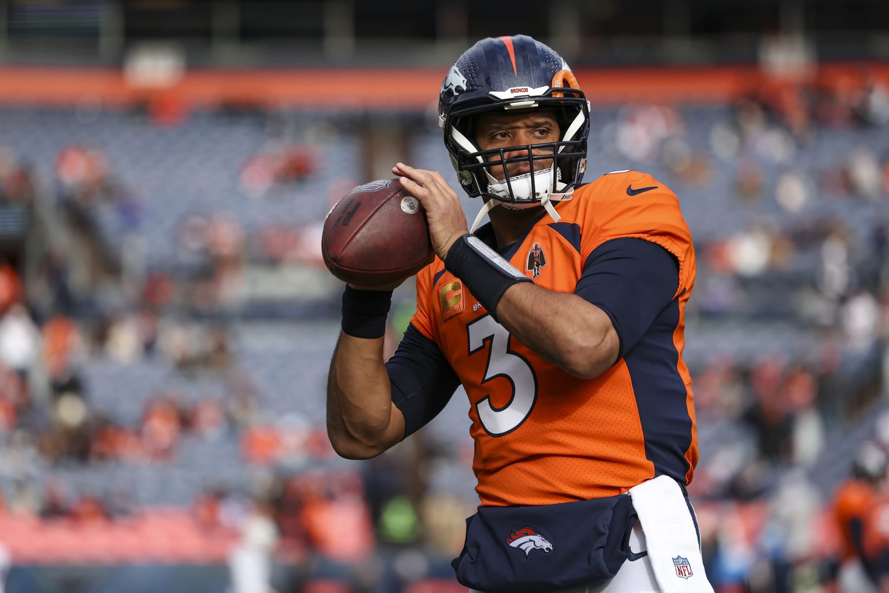 DENVER, CO - DECEMBER 31: Russell Wilson #3 of the Denver Broncos warms up prior to an NFL football game against the Los Angeles Chargers at Empower Field at Mile High on December 31, 2023 in Denver, Colorado. (Photo by Perry Knotts/Getty Images)