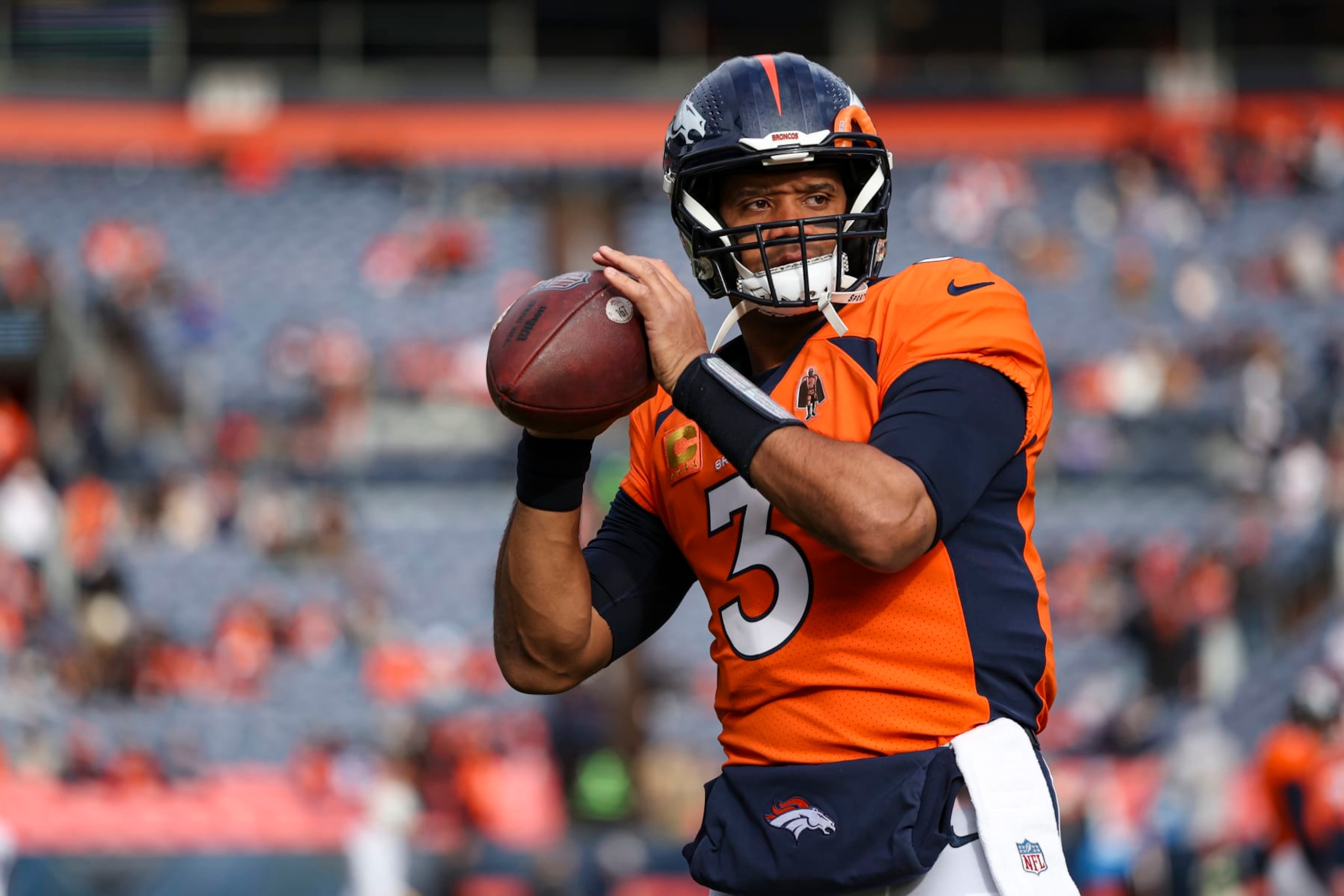 DENVER, CO - DECEMBER 31: Russell Wilson #3 of the Denver Broncos warms up prior to an NFL football game against the Los Angeles Chargers at Empower Field at Mile High on December 31, 2023 in Denver, Colorado. (Photo by Perry Knotts/Getty Images)