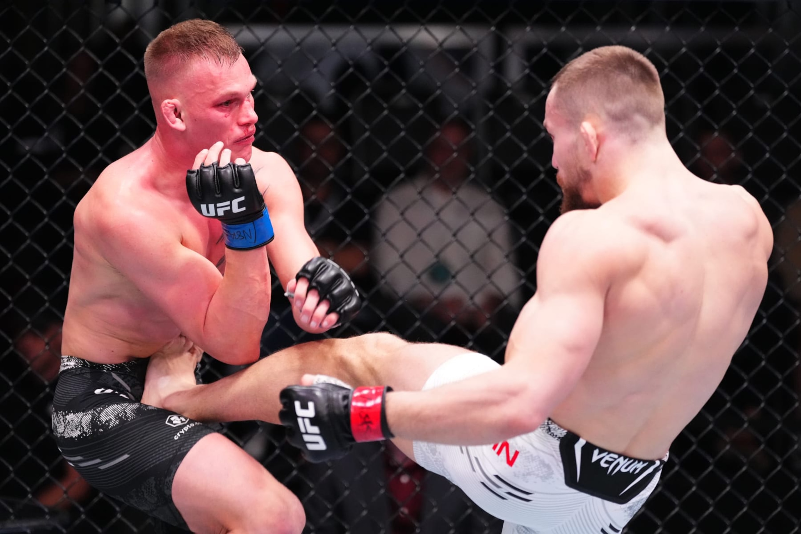 LAS VEGAS, NEVADA - MARCH 02: (R-L) Ludovit Klein of Slovakia kicks AJ Cunningham in a lightweight bout during the UFC Fight Night event at UFC APEX on March 02, 2024 in Las Vegas, Nevada. (Photo by Jeff Bottari/Zuffa LLC via Getty Images)