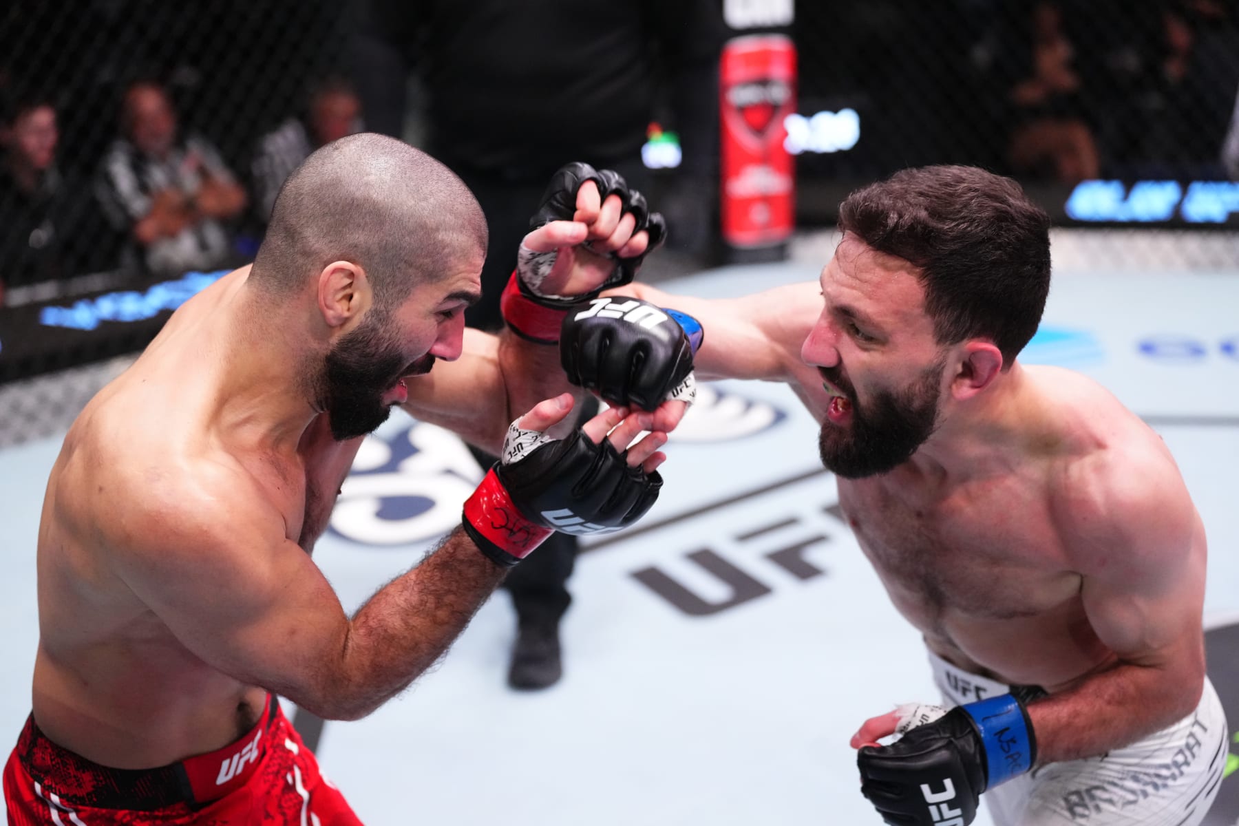 LAS VEGAS, NEVADA - MARCH 02: (R-L) Javid Basharat of Afghanistan punches Aiemann Zahabi of Canada in a bantamweight bout during the UFC Fight Night event at UFC APEX on March 02, 2024 in Las Vegas, Nevada. (Photo by Jeff Bottari/Zuffa LLC via Getty Images)