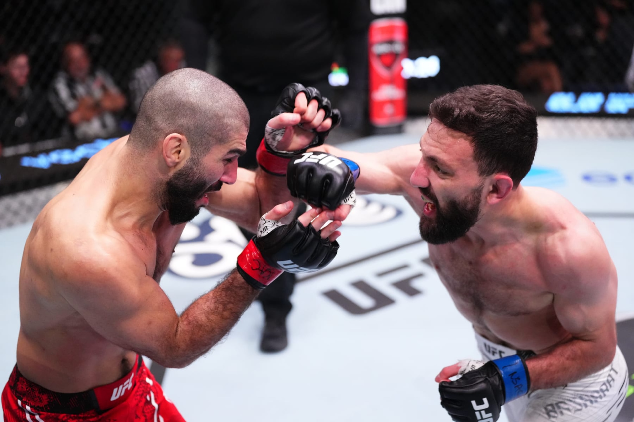 LAS VEGAS, NEVADA - MARCH 02: (R-L) Javid Basharat of Afghanistan punches Aiemann Zahabi of Canada in a bantamweight bout during the UFC Fight Night event at UFC APEX on March 02, 2024 in Las Vegas, Nevada. (Photo by Jeff Bottari/Zuffa LLC via Getty Images)