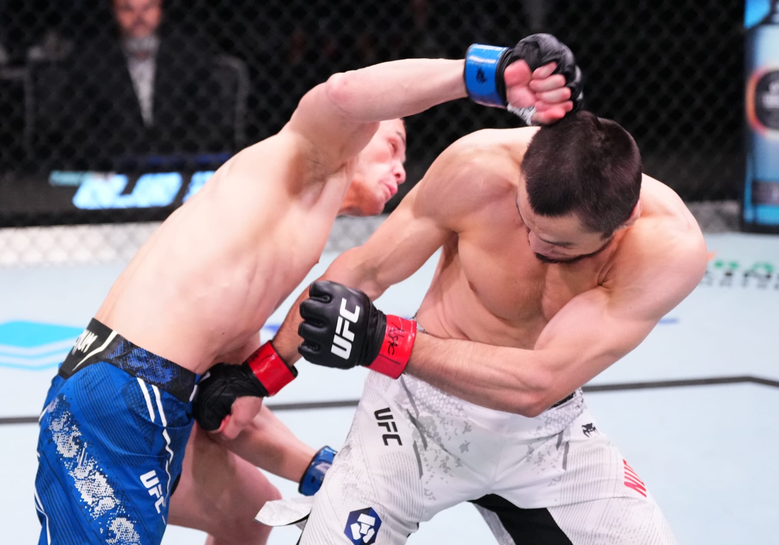 LAS VEGAS, NEVADA - MARCH 02: (L-R) Bekzat Almakhan of Kazakstan punches Umar Nurmagomedov of Russia in a bantamweight bout during the UFC Fight Night event at UFC APEX on March 02, 2024 in Las Vegas, Nevada. (Photo by Jeff Bottari/Zuffa LLC via Getty Images)