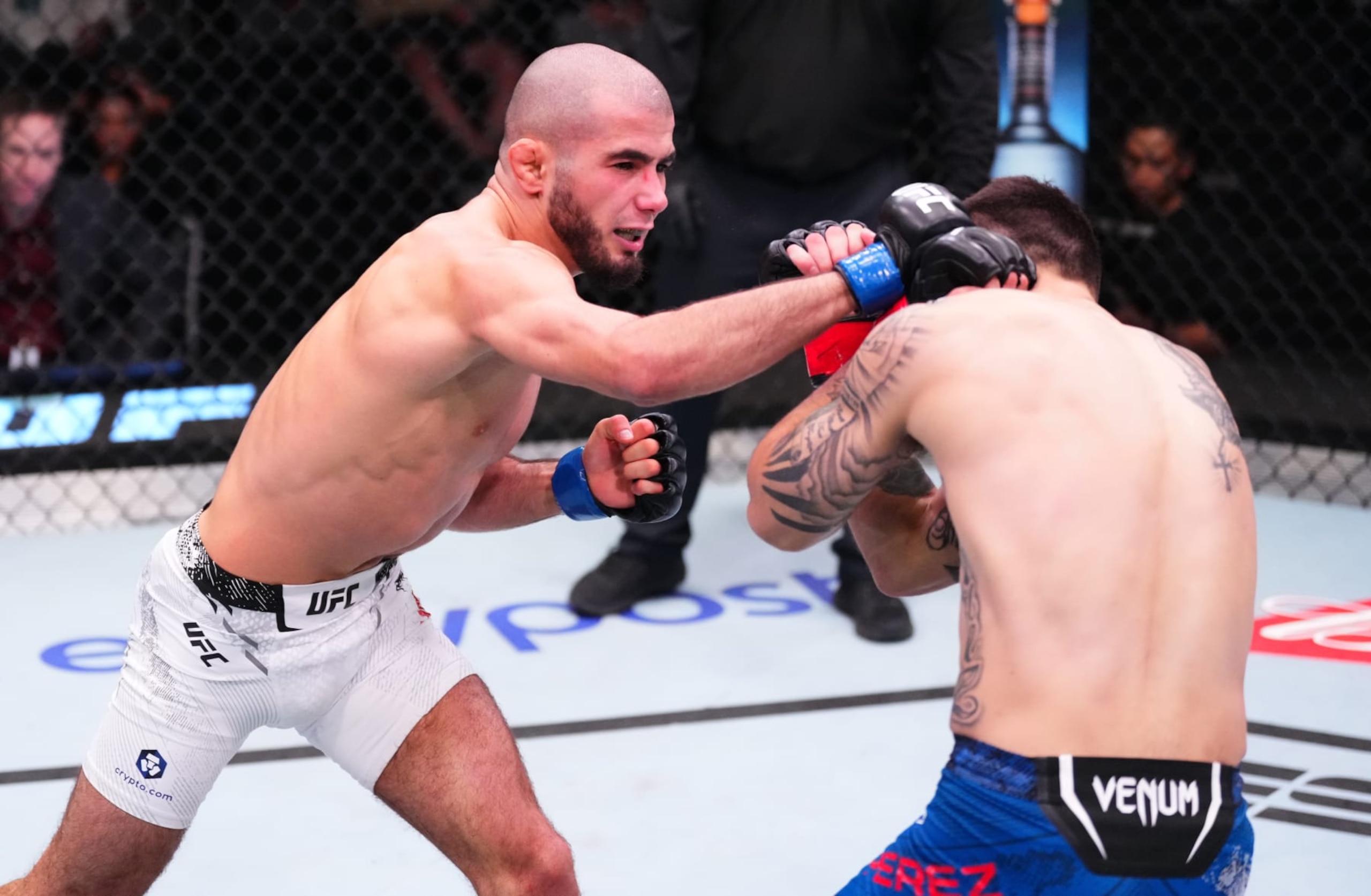 LAS VEGAS, NEVADA - MARCH 02: (L-R) Muhammad Mokaev of Russia punches Alex Perez in a flyweight bout during the UFC Fight Night event at UFC APEX on March 02, 2024 in Las Vegas, Nevada. (Photo by Jeff Bottari/Zuffa LLC via Getty Images)