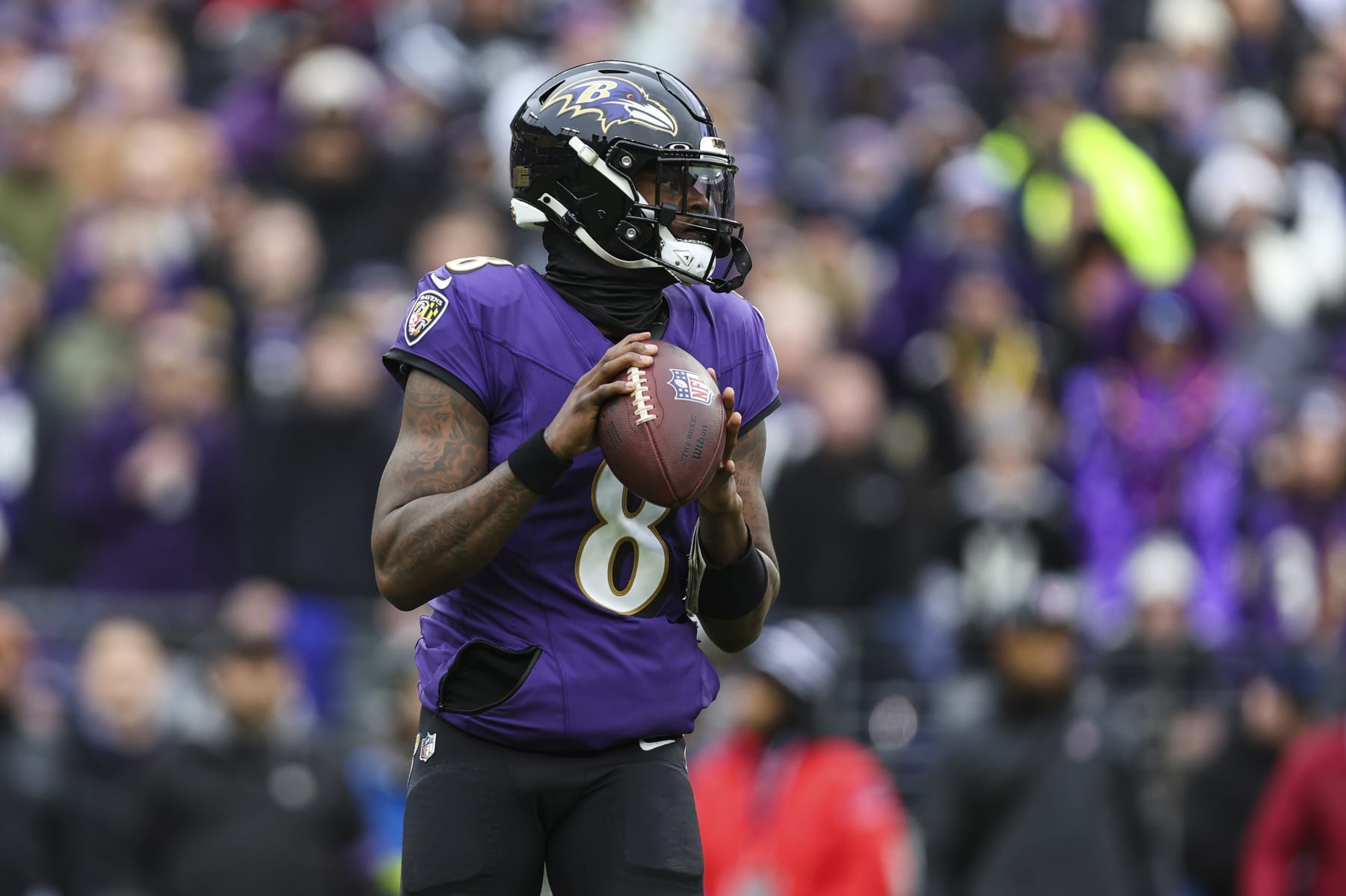 BALTIMORE, MD - JANUARY 28: Lamar Jackson #8 of the Baltimore Ravens drops back to pass during the AFC Championship NFL football game against the Kansas City Chiefs at M&T Bank Stadium on January 28, 2024 in Baltimore, Maryland. (Photo by Perry Knotts/Getty Images)