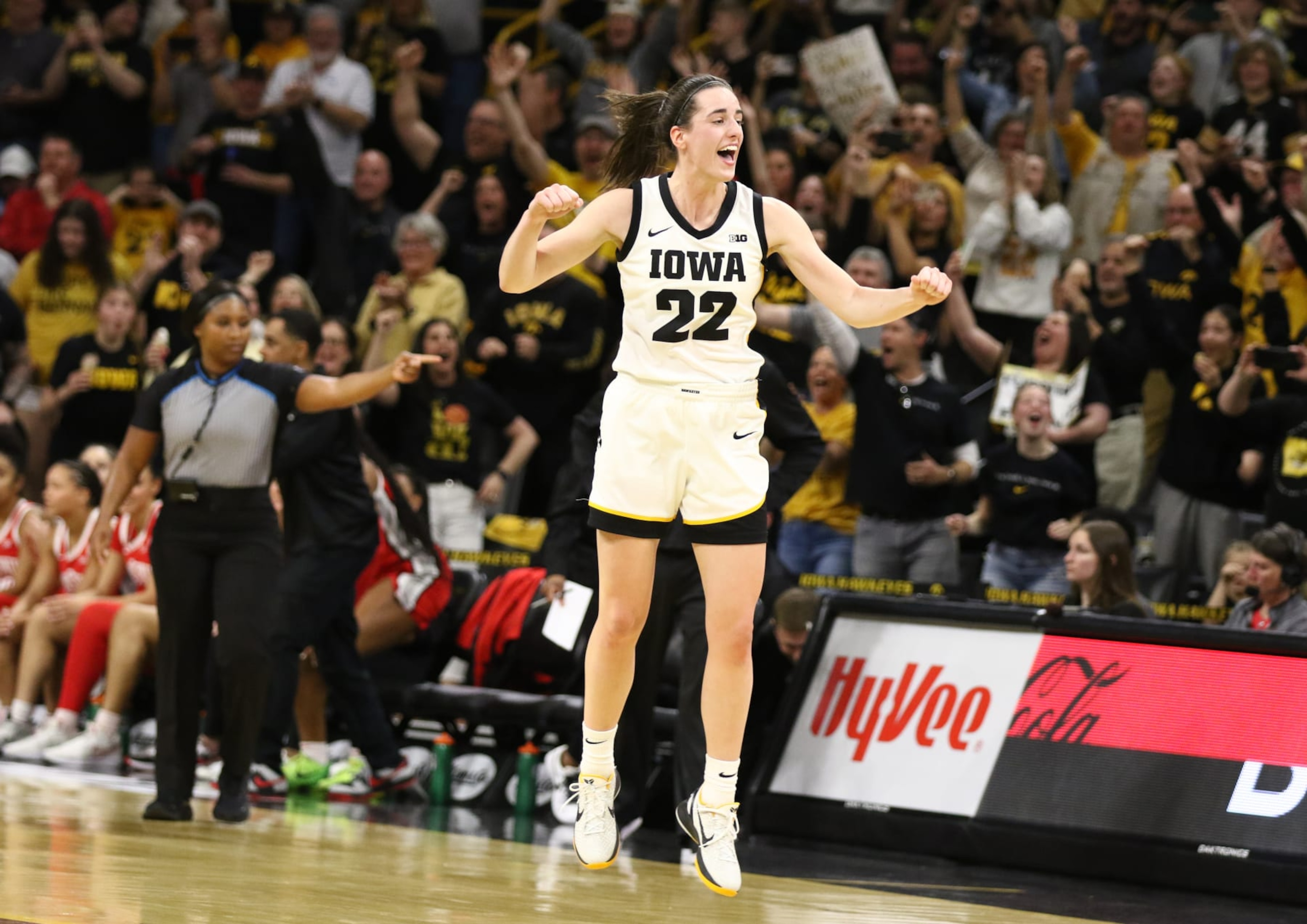 IOWA CITY, IOWA- MARCH 3:  Guard Caitlin Clark #22 of the Iowa Hawkeyes celebrates after breaking Pete Maravich's all-time NCAA scoring record during the first half against the Ohio State Buckeyes at Carver-Hawkeye Arena on March 3, 2024 in Iowa City, Iowa.  (Photo by Matthew Holst/Getty Images)