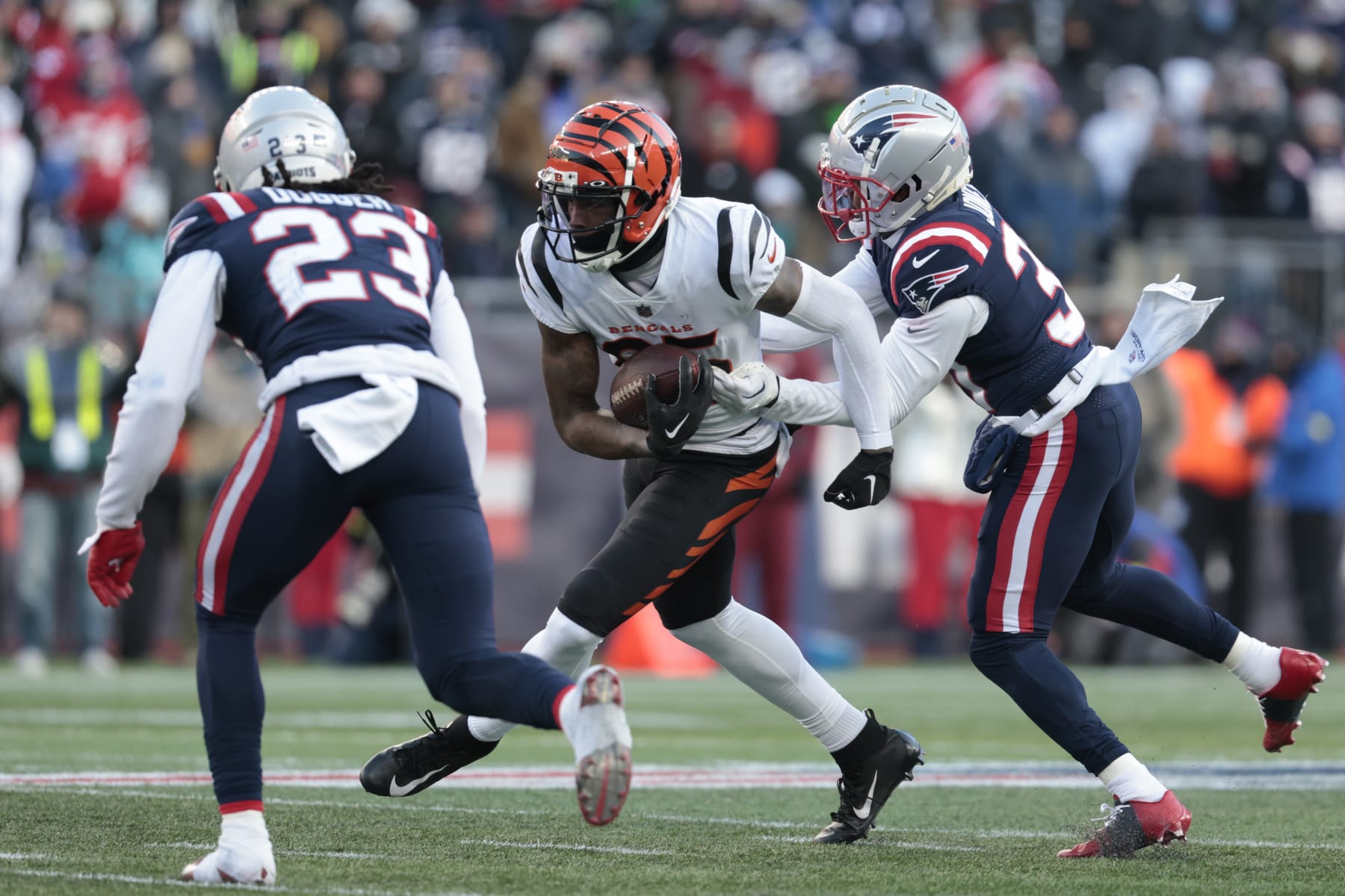 FOXBOROUGH, MASSACHUSETTS - DECEMBER 24: Tee Higgins #85 of the Cincinnati Bengals breaks a tackle during the second half against the New England Patriots at Gillette Stadium on December 24, 2022 in Foxborough, Massachusetts. (Photo by Nick Grace/Getty Images)