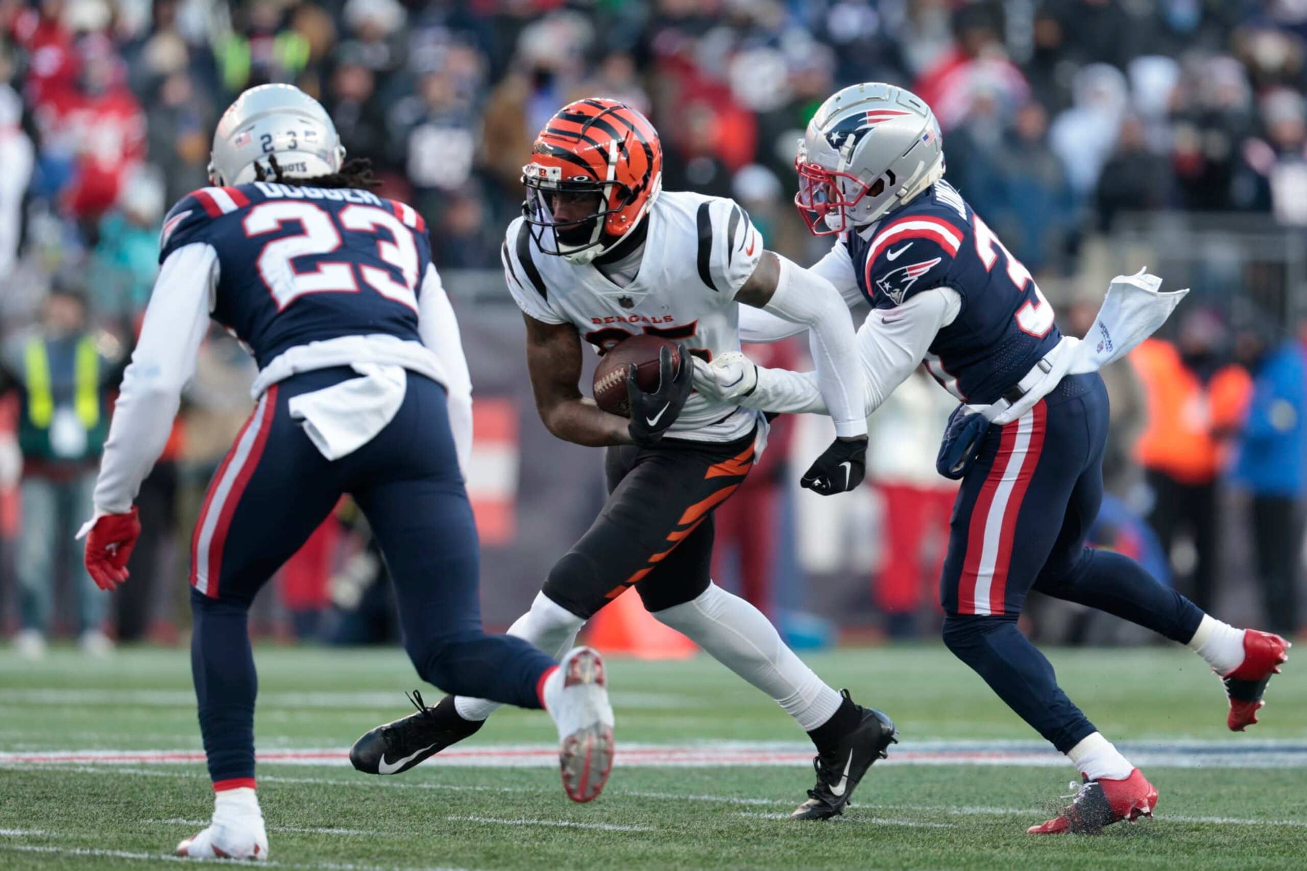 FOXBOROUGH, MASSACHUSETTS - DECEMBER 24: Tee Higgins #85 of the Cincinnati Bengals breaks a tackle during the second half against the New England Patriots at Gillette Stadium on December 24, 2022 in Foxborough, Massachusetts. (Photo by Nick Grace/Getty Images)