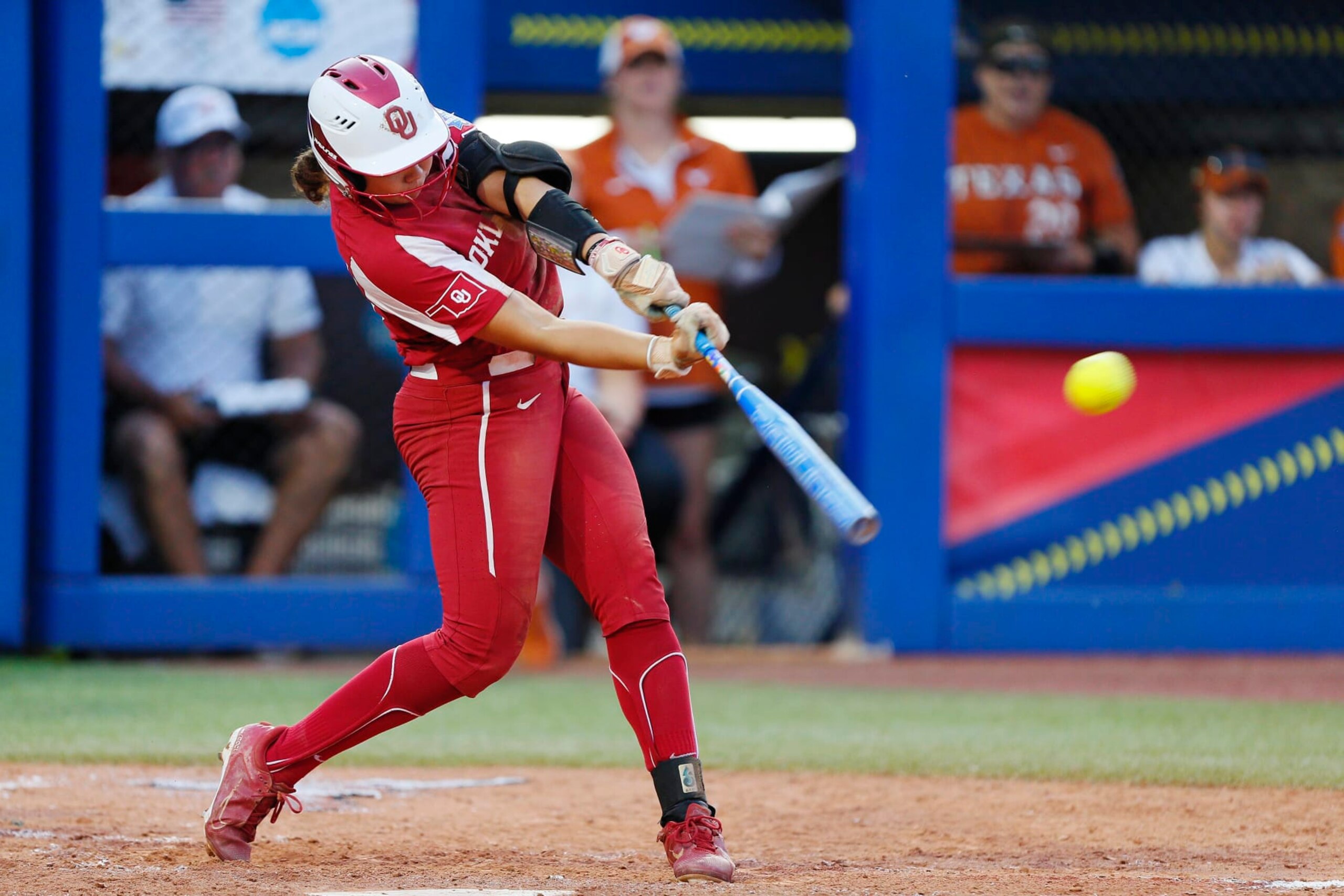 OKLAHOMA CITY, OK - JUNE 9:  Alyssa Brito #33 of the Oklahoma Sooners hits an RBI double against the Texas Longhorns in the fifth inning to take a lead during the NCAA Women's College World Series finals at the USA Softball Hall of Fame Complex on June 9, 2022 in Oklahoma City, Oklahoma.  Oklahoma won the NCAA Championship with a 10-5 victory.  (Photo by Brian Bahr/Getty Images)
