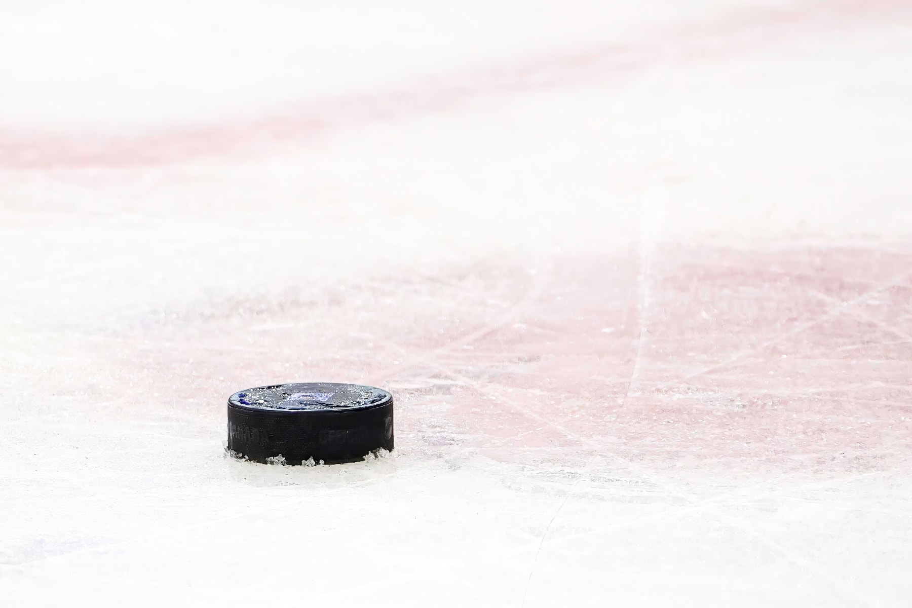 NEW YORK, NY - DECEMBER 10: A general view of a puck with a New York Rangers logo sitting on the ice during the National Hockey League game between the Los Angeles Kings and the New York Rangers on December 10, 2023 at Madison Square Garden in New York, NY. (Photo by Joshua Sarner/Icon Sportswire via Getty Images)