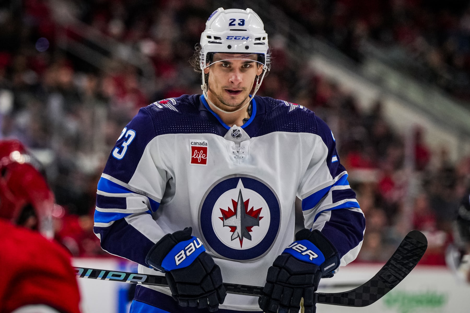 RALEIGH, NORTH CAROLINA - MARCH 02: Sean Monahan #23 of the Winnipeg Jets looks on during the second period against the Carolina Hurricanes at PNC Arena on March 02, 2024 in Raleigh, North Carolina. (Photo by Josh Lavallee/NHLI via Getty Images)