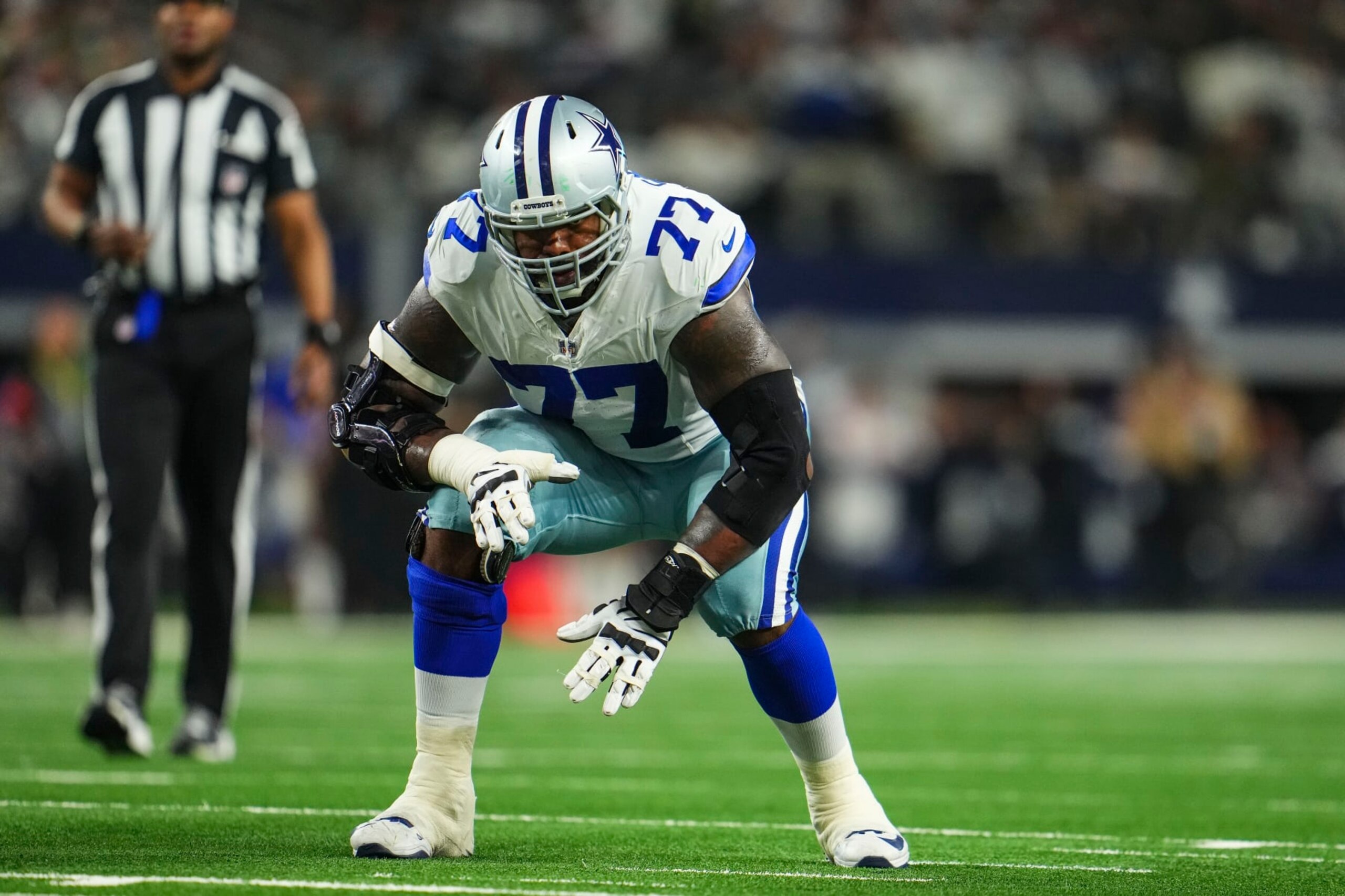 DALLAS, TX - JANUARY 14: Tyron Smith #77 of the Dallas Cowboys lines up during an NFL wild-card playoff football game against the Green Bay Packers at AT&T Stadium on January 14, 2024 in Dallas, Texas. (Photo by Cooper Neill/Getty Images)