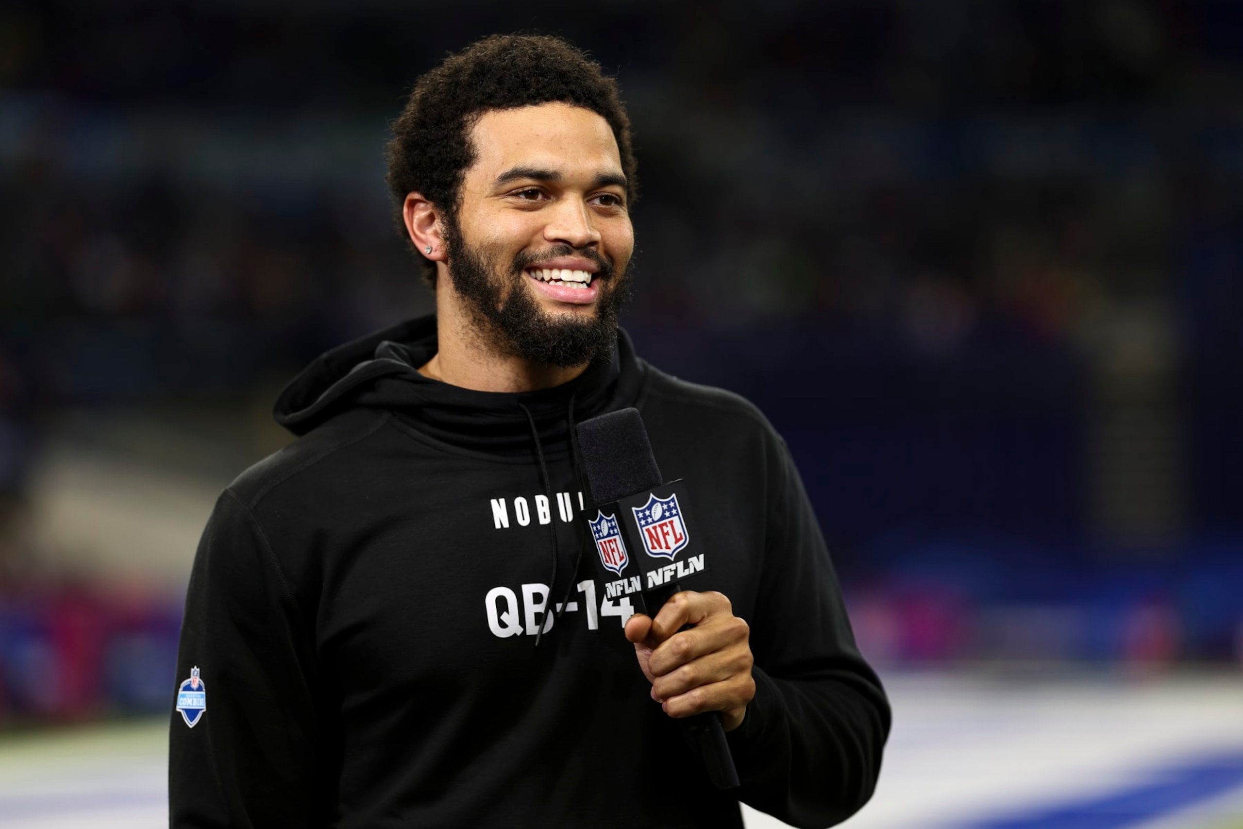 INDIANAPOLIS, INDIANA - MARCH 2: Caleb Williams #QB14 of Southern California smiles while doing an interview with NFL Network during the NFL Combine at the Indiana Convention Center on March 2, 2024 in Indianapolis, Indiana. (Photo by Kevin Sabitus/Getty Images) INDIANAPOLIS, INDIANA - MARCH 2: Caleb Williams #QB14 of Southern California smiles while doing an interview with NFL Network during the NFL Combine at the Indiana Convention Center on March 2, 2024 in Indianapolis, Indiana. (Photo by Kevin Sabitus/Getty Images)