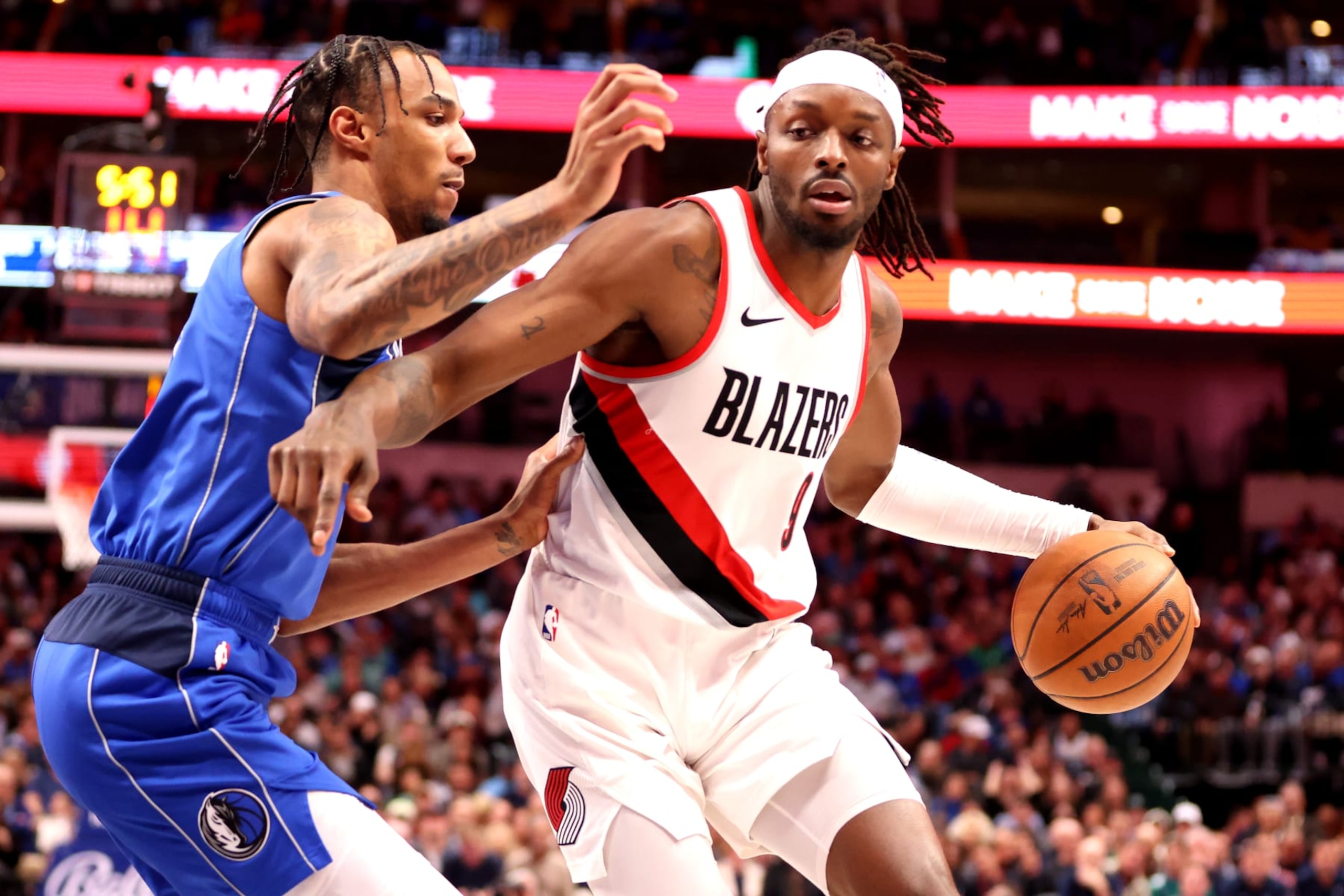 DALLAS, TEXAS - JANUARY 05: Jerami Grant #9 of the Portland Trail Blazers drives to the basket against A.J. Lawson #9 of the Dallas Mavericks in the first half at American Airlines Center on January 05, 2024 in Dallas, Texas. NOTE TO USER: User expressly acknowledges and agrees that, by downloading and or using this photograph, User is consenting to the terms and conditions of the Getty Images License Agreement. (Photo by Tim Heitman/Getty Images)