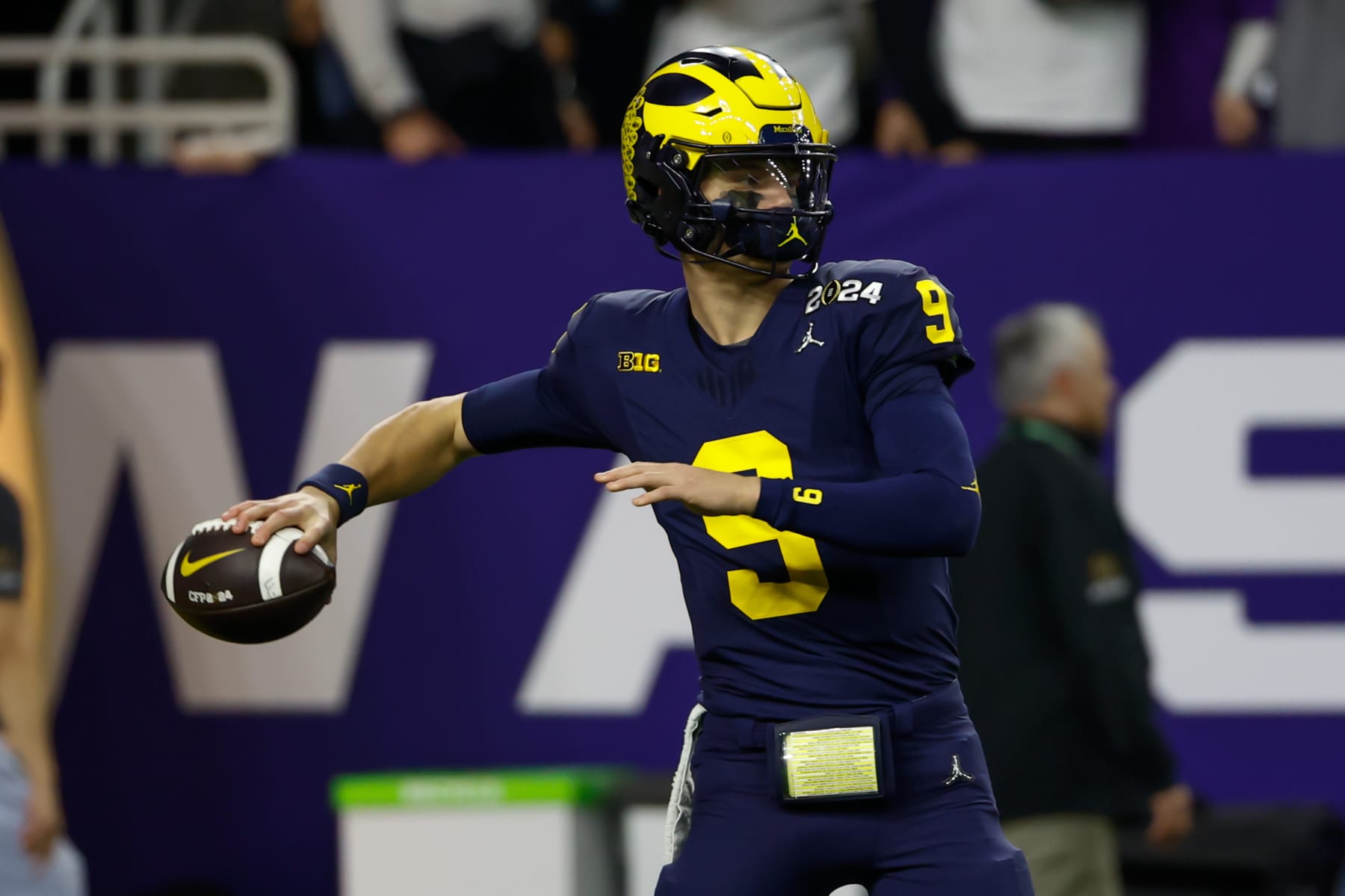 HOUSTON, TX - JANUARY 08: Michigan Wolverines quarterback J.J. McCarthy (9) throws some warm up passes before the CFP National Championship game Michigan Wolverines and Washington Huskies on January 8, 2024, at NRG Stadium in Houston, Texas. (Photo by David Buono/Icon Sportswire via Getty Images)