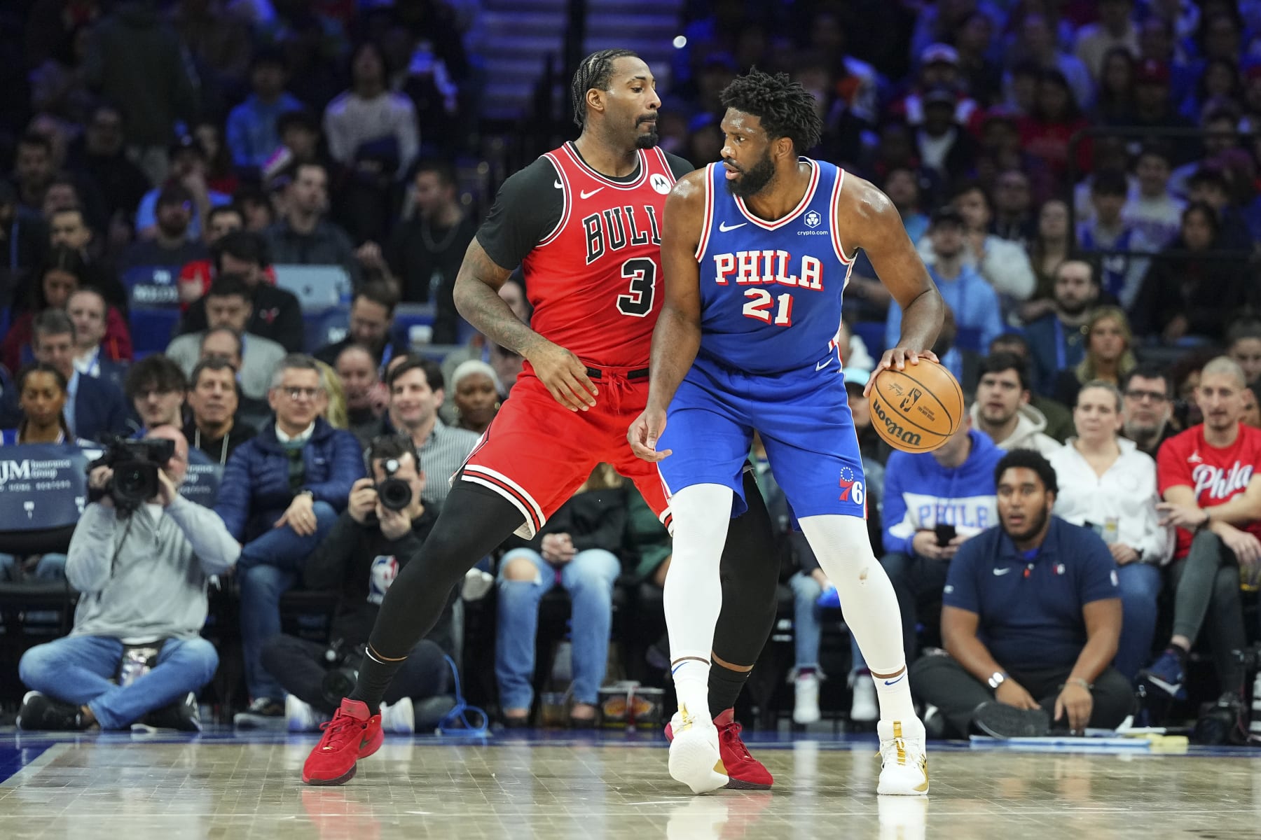 PHILADELPHIA, PENNSYLVANIA - JANUARY 2: Joel Embiid #21 of the Philadelphia 76ers dribbles the ball against Andre Drummond #3 of the Chicago Bulls in the first quarter at the Wells Fargo Center on January 2, 2024 in Philadelphia, Pennsylvania. NOTE TO USER: User expressly acknowledges and agrees that, by downloading and or using this photograph, User is consenting to the terms and conditions of the Getty Images License Agreement. (Photo by Mitchell Leff/Getty Images)