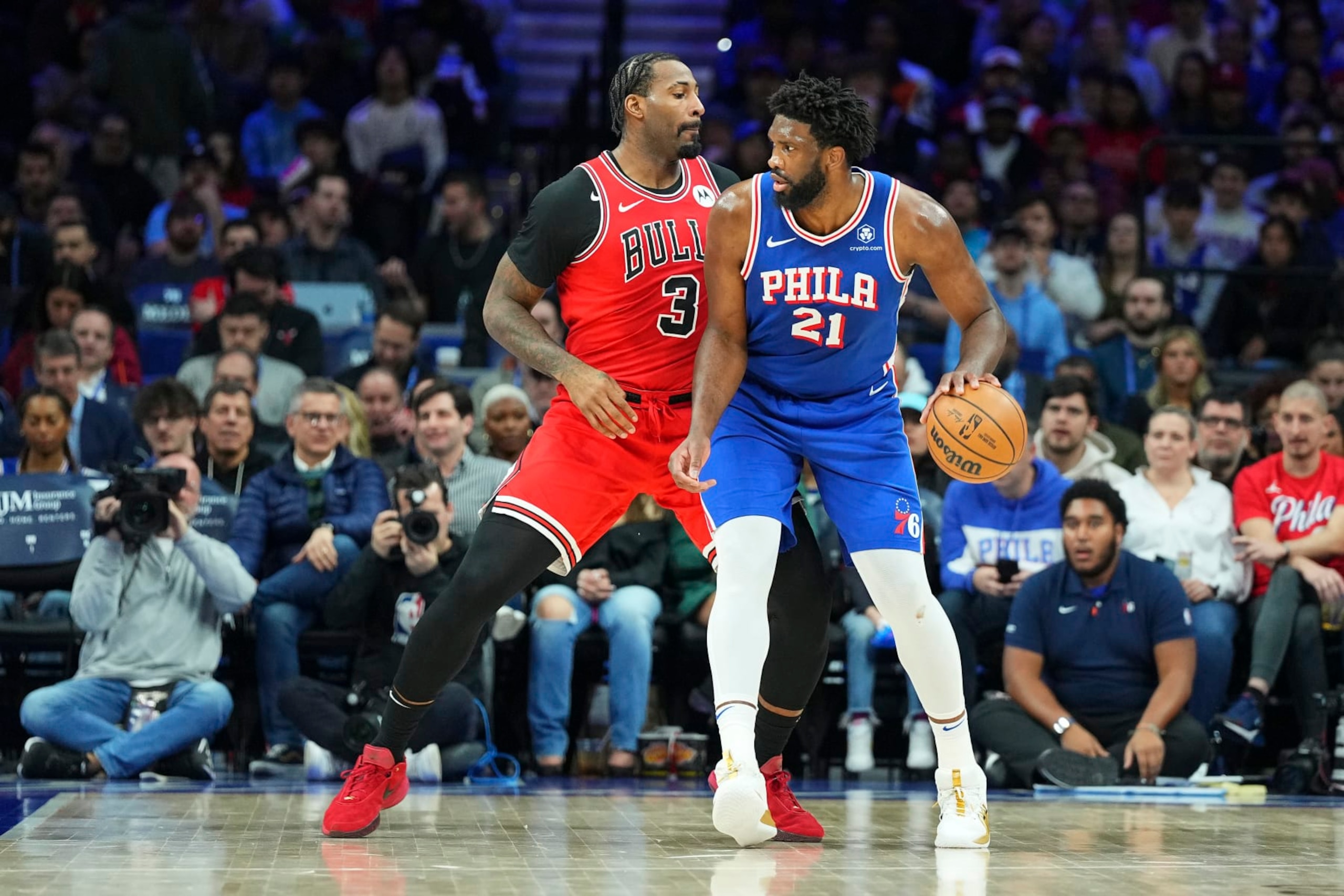 PHILADELPHIA, PENNSYLVANIA - JANUARY 2: Joel Embiid #21 of the Philadelphia 76ers dribbles the ball against Andre Drummond #3 of the Chicago Bulls in the first quarter at the Wells Fargo Center on January 2, 2024 in Philadelphia, Pennsylvania. NOTE TO USER: User expressly acknowledges and agrees that, by downloading and or using this photograph, User is consenting to the terms and conditions of the Getty Images License Agreement. (Photo by Mitchell Leff/Getty Images)