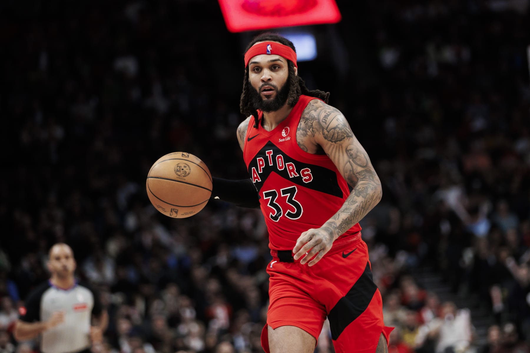 TORONTO, CANADA - FEBRUARY 28: Gary Trent Jr. #33 of the Toronto Raptors dribbles against the Dallas Mavericks second half of their NBA game at Scotiabank Arena on February 28, 2024 in Toronto, Canada. NOTE TO USER: User expressly acknowledges and agrees that, by downloading and or using this photograph, User is consenting to the terms and conditions of the Getty Images License Agreement. (Photo by Cole Burston/Getty Images)