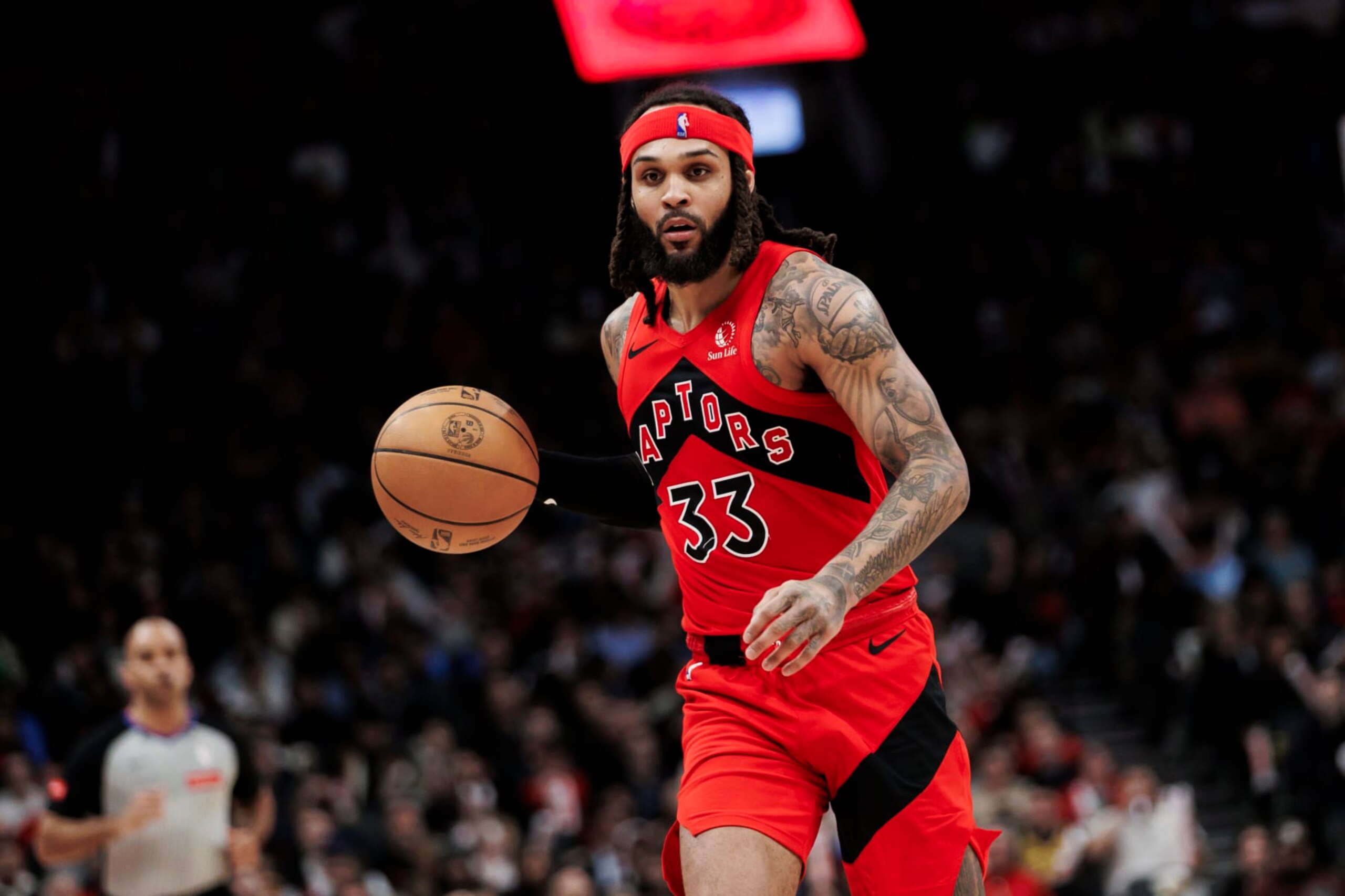 TORONTO, CANADA - FEBRUARY 28: Gary Trent Jr. #33 of the Toronto Raptors dribbles against the Dallas Mavericks second half of their NBA game at Scotiabank Arena on February 28, 2024 in Toronto, Canada. NOTE TO USER: User expressly acknowledges and agrees that, by downloading and or using this photograph, User is consenting to the terms and conditions of the Getty Images License Agreement. (Photo by Cole Burston/Getty Images)