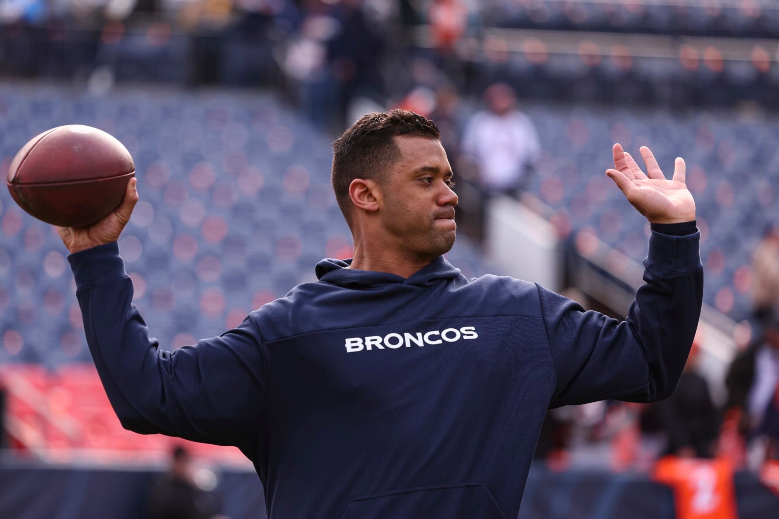 DENVER, CO - DECEMBER 31: Russell Wilson #3 of the Denver Broncos warms up prior to an NFL football game against the Los Angeles Chargers at Empower Field at Mile High on December 31, 2023 in Denver, Colorado. (Photo by Perry Knotts/Getty Images)