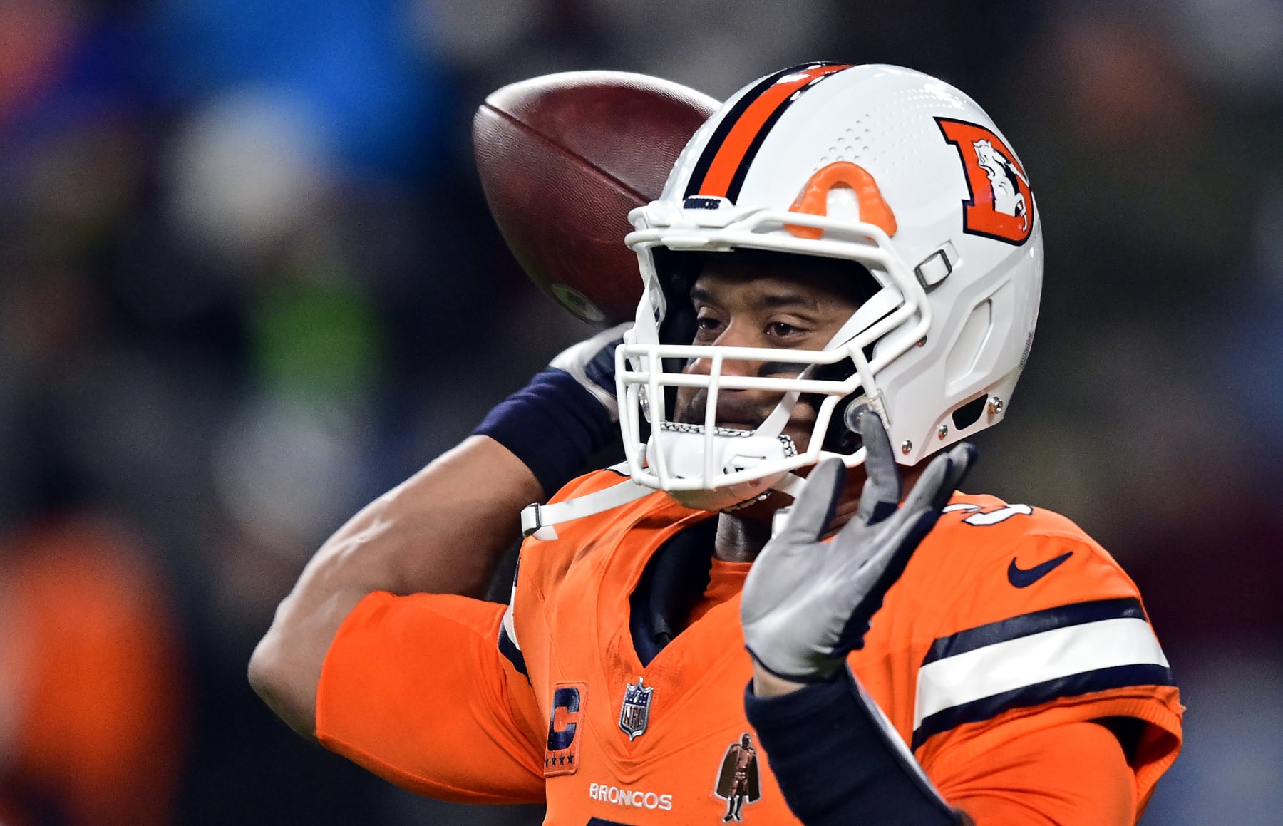 DENVER, COLORADO - DECEMBER 24:  Quarterback Russell Wilson #3 of the Denver Broncos warms up prior to the game against the New England Patriots at Empower Field At Mile High on December 24, 2023 in Denver, Colorado. (Photo by Dustin Bradford/Getty Images)