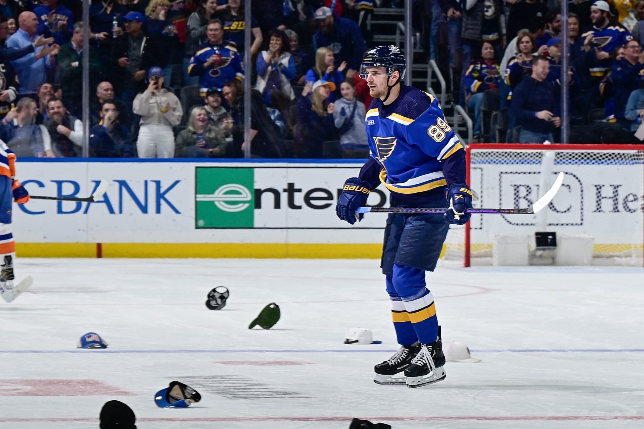 ST. LOUIS, MO - FEBRUARY 22: Pavel Buchnevich #89 of the St. Louis Blues skates among fans hats after scoring his third goal of the game against the New York Islanders on February 22, 2024 at the Enterprise Center in St. Louis, Missouri. (Photo by Scott Rovak/NHLI via Getty Images) ST. LOUIS, MO - FEBRUARY 22: Pavel Buchnevich #89 of the St. Louis Blues skates among fans hats after scoring his third goal of the game against the New York Islanders on February 22, 2024 at the Enterprise Center in St. Louis, Missouri. (Photo by Scott Rovak/NHLI via Getty Images)