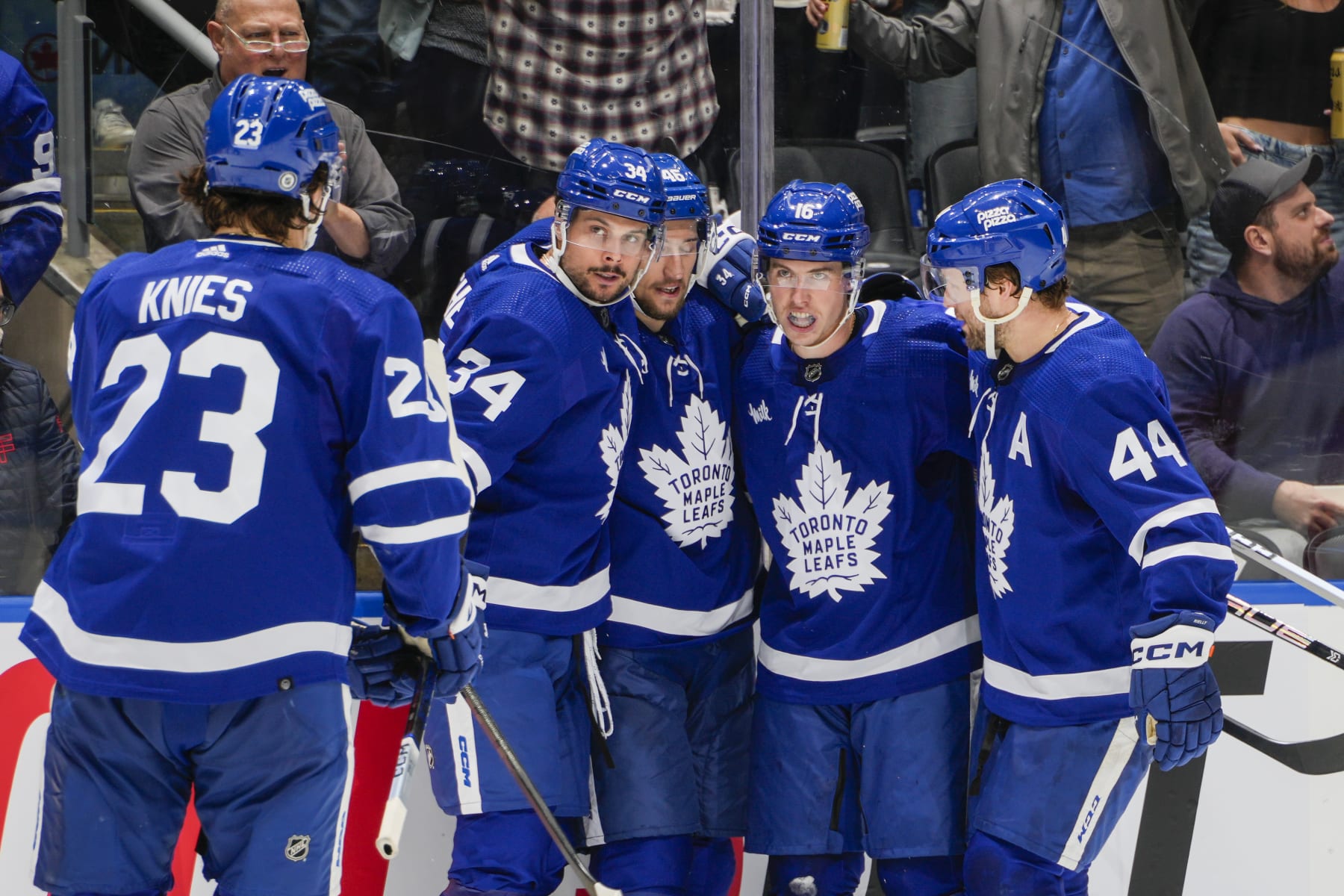 TORONTO, ON - MARCH 2: Mitchell Marner #16 of the Toronto Maple Leafs celebrates his goal against the New York Rangers with teammates Matthew Knies #23, Auston Matthews #34, Ilya Lyubushkin #46 and Morgan Rielly #44 during the second period at Scotiabank Arena on March 2, 2024 in Toronto, Ontario, Canada. (Photo by Kevin Sousa/NHLI via Getty Images)