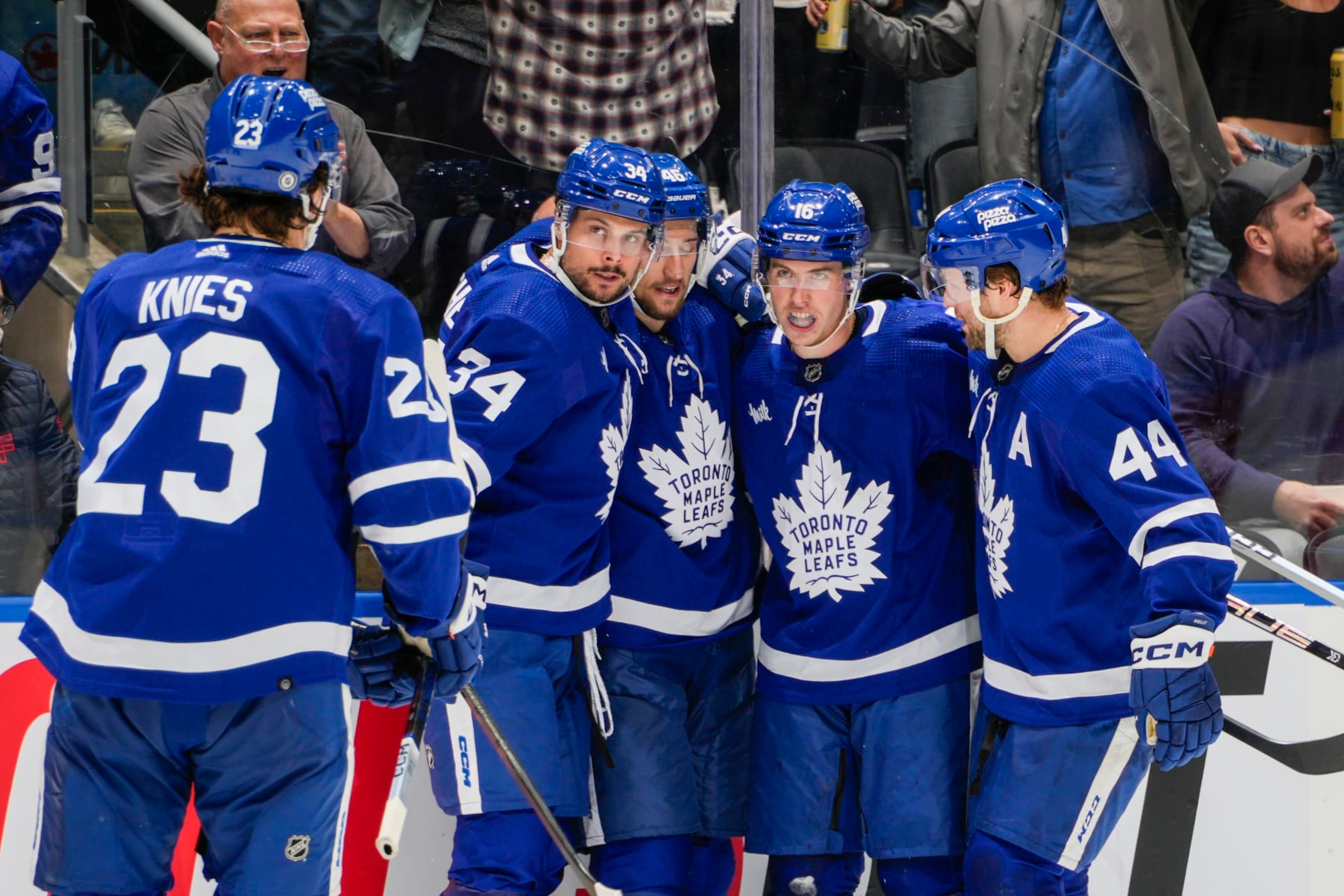 TORONTO, ON - MARCH 2: Mitchell Marner #16 of the Toronto Maple Leafs celebrates his goal against the New York Rangers with teammates Matthew Knies #23, Auston Matthews #34, Ilya Lyubushkin #46 and Morgan Rielly #44 during the second period at Scotiabank Arena on March 2, 2024 in Toronto, Ontario, Canada. (Photo by Kevin Sousa/NHLI via Getty Images) TORONTO, ON - MARCH 2: Mitchell Marner #16 of the Toronto Maple Leafs celebrates his goal against the New York Rangers with teammates Matthew Knies #23, Auston Matthews #34, Ilya Lyubushkin #46 and Morgan Rielly #44 during the second period at Scotiabank Arena on March 2, 2024 in Toronto, Ontario, Canada. (Photo by Kevin Sousa/NHLI via Getty Images)