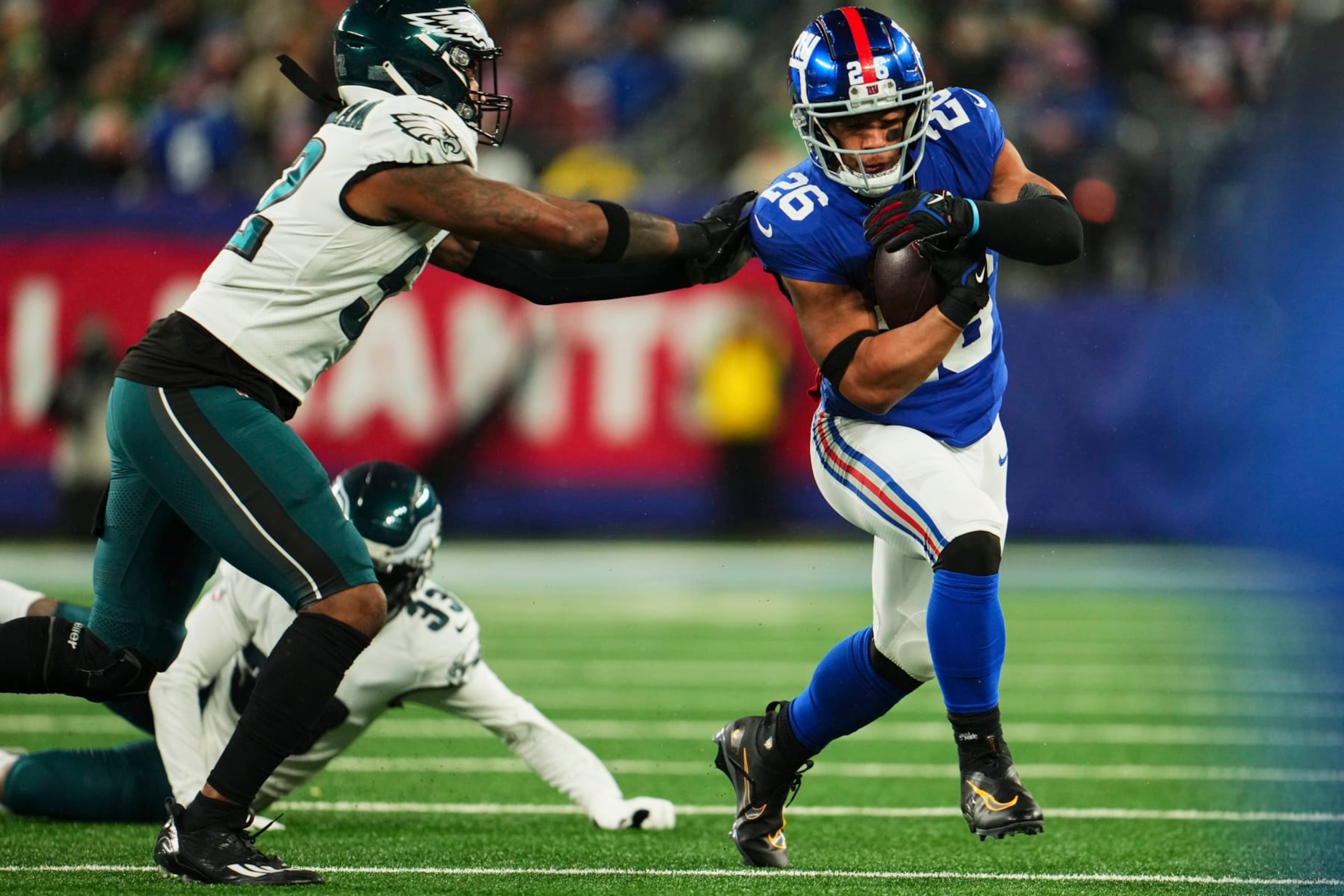 EAST RUTHERFORD, NJ - JANUARY 07: Saquon Barkley #26 of the New York Giants runs with the ball against the Philadelphia Eagles during the first half at MetLife Stadium on January 7, 2024 in East Rutherford, New Jersey. (Photo by Cooper Neill/Getty Images) EAST RUTHERFORD, NJ - JANUARY 07: Saquon Barkley #26 of the New York Giants runs with the ball against the Philadelphia Eagles during the first half at MetLife Stadium on January 7, 2024 in East Rutherford, New Jersey. (Photo by Cooper Neill/Getty Images)