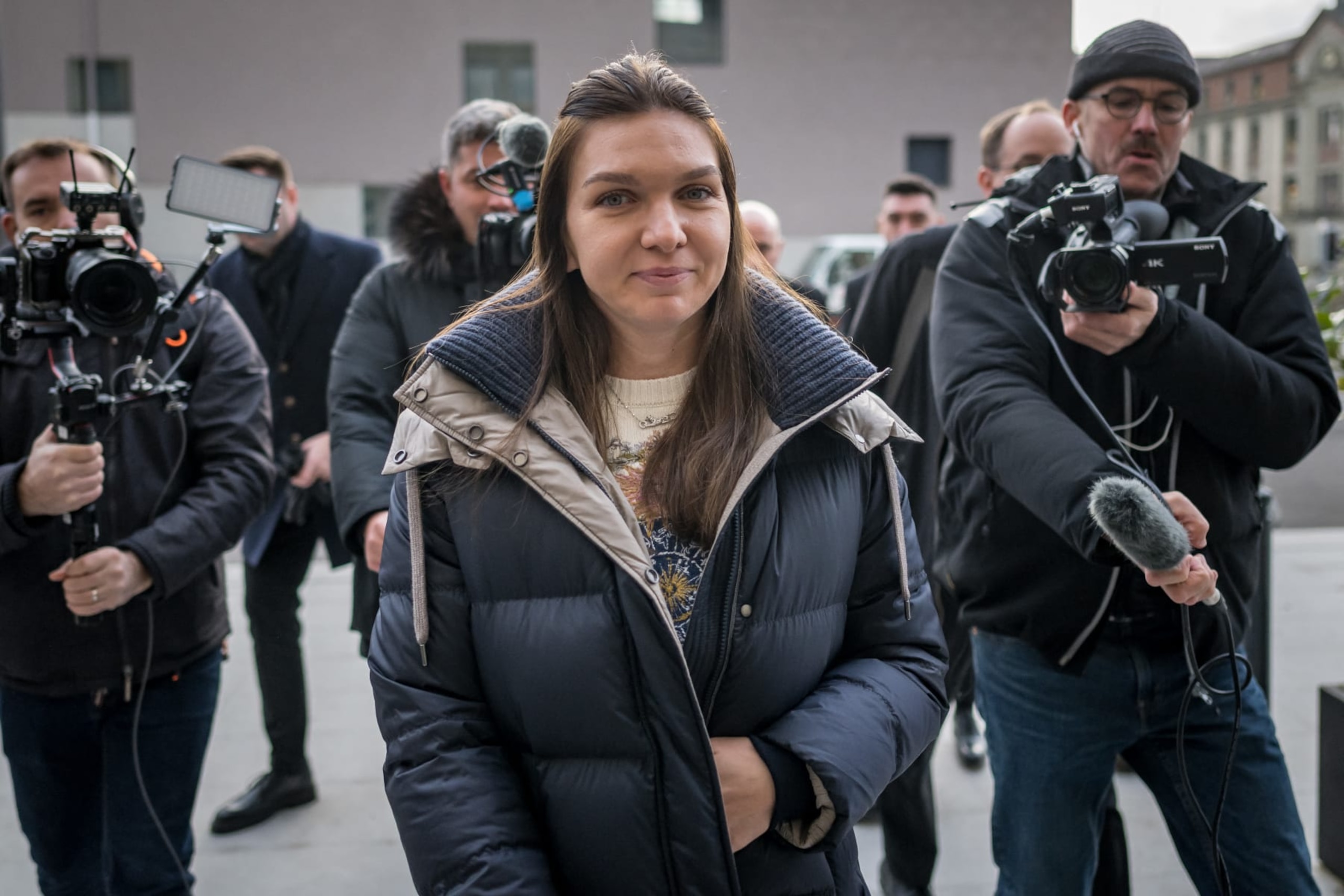 Former world number one tennis player Romania's Simona Halep (C) arrives at the Court of Arbitration for Sport in Lausanne on February 7, 2024, for her appeal against a four-year doping ban. The two-time Grand Slam singles champion tested positive for roxadustat after the US Open in 2022 and was charged with a separate second anti-doping breach last year relating to irregularities in her athlete biological passport. (Photo by Fabrice COFFRINI / AFP) (Photo by FABRICE COFFRINI/AFP via Getty Images) Former world number one tennis player Romania's Simona Halep (C) arrives at the Court of Arbitration for Sport in Lausanne on February 7, 2024, for her appeal against a four-year doping ban. The two-time Grand Slam singles champion tested positive for roxadustat after the US Open in 2022 and was charged with a separate second anti-doping breach last year relating to irregularities in her athlete biological passport. (Photo by Fabrice COFFRINI / AFP) (Photo by FABRICE COFFRINI/AFP via Getty Images)