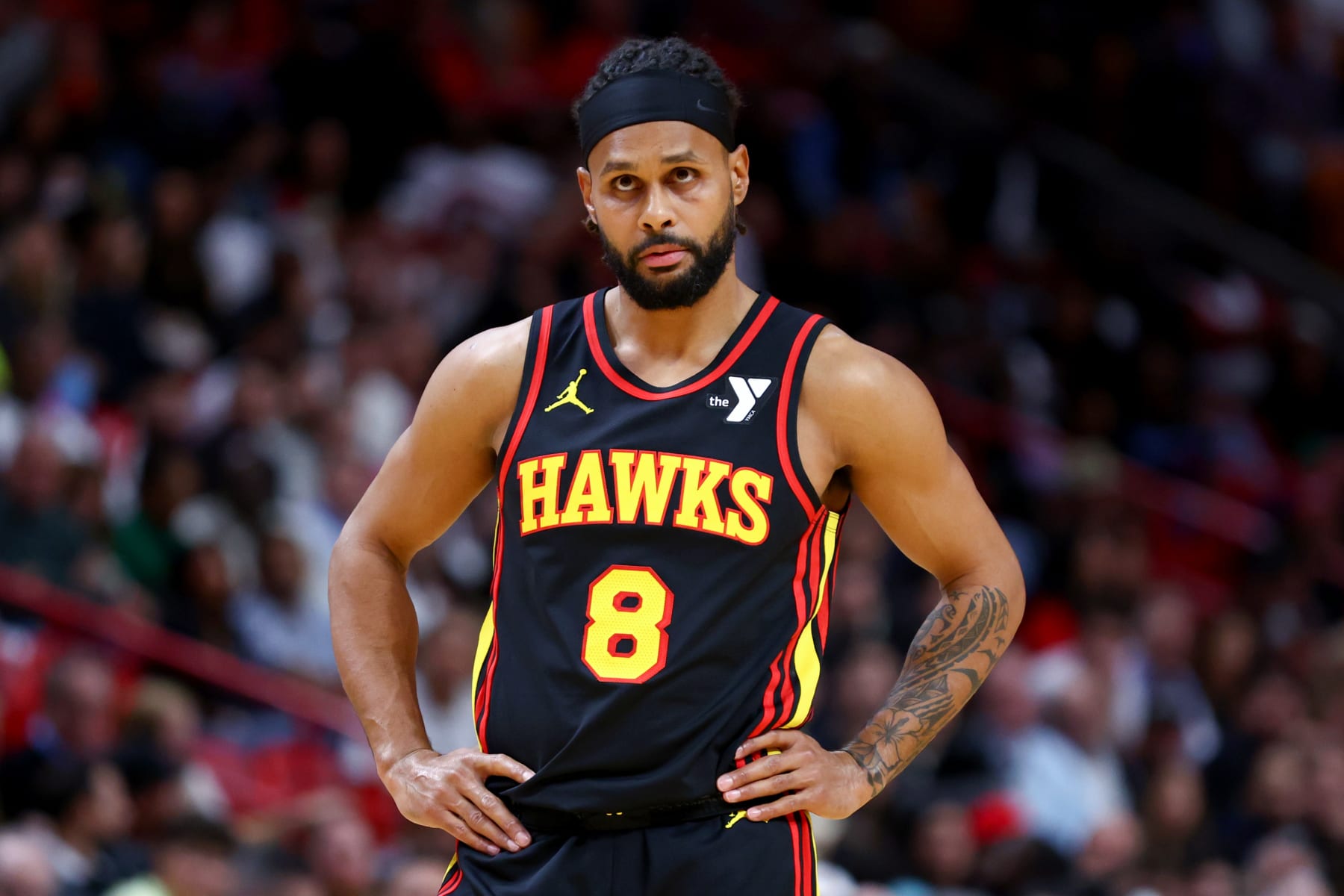 MIAMI, FLORIDA - DECEMBER 22: Patty Mills #8 of the Atlanta Hawks looks on against the Miami Heat during the third quarter of the game at Kaseya Center on December 22, 2023 in Miami, Florida. NOTE TO USER: User expressly acknowledges and agrees that, by downloading and or using this photograph, User is consenting to the terms and conditions of the Getty Images License Agreement. (Photo by Megan Briggs/Getty Images)
