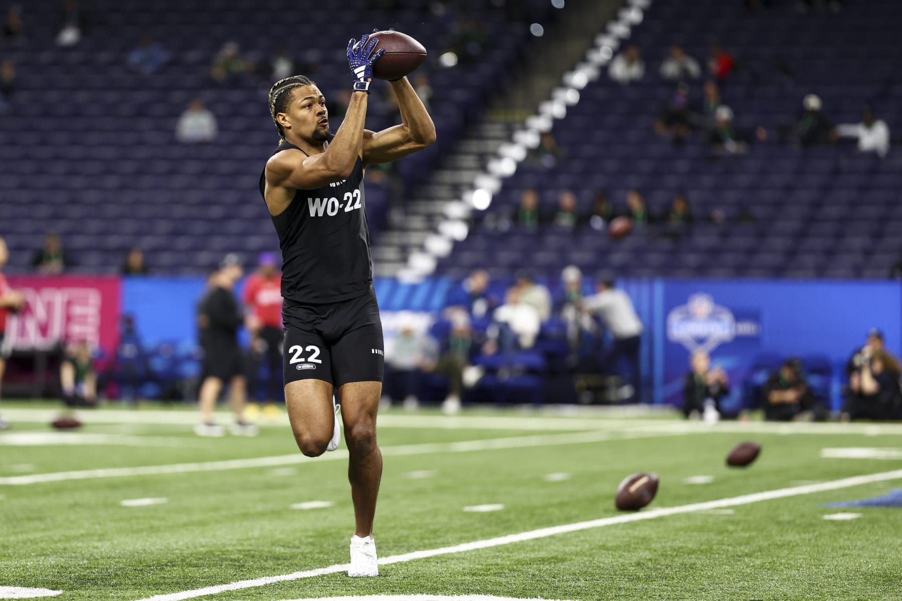 INDIANAPOLIS, INDIANA - MARCH 2: Rome Odunze #WO22 of Washington participates in a drill during the NFL Combine at the Lucas Oil Stadium on March 2, 2024 in Indianapolis, Indiana. (Photo by Kevin Sabitus/Getty Images)