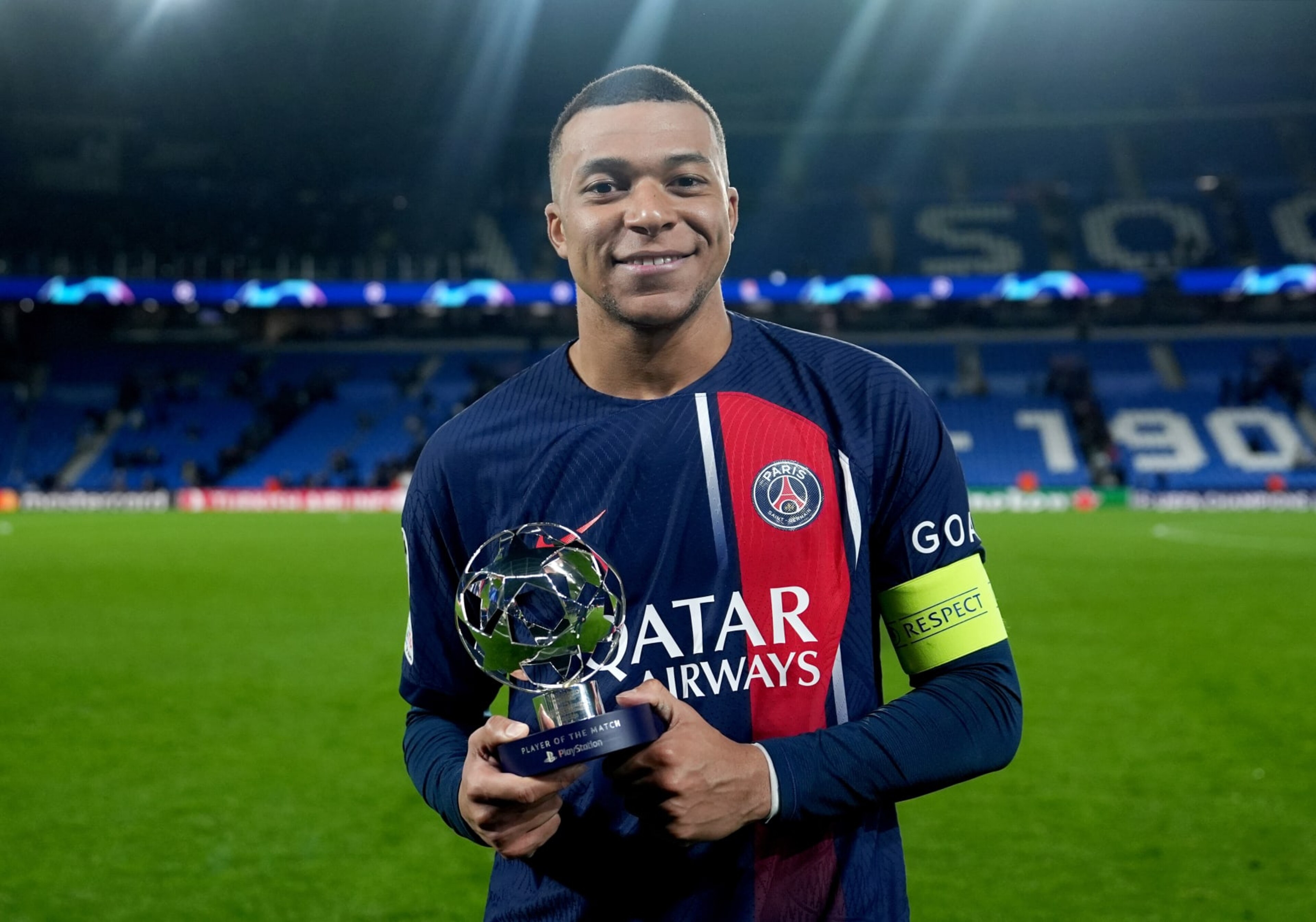 SAN SEBASTIAN, SPAIN - MARCH 05: Kylian Mbappe of Paris Saint-Germain poses for a photo with the PlayStation Player Of The Match award after the team's victory in the UEFA Champions League 2023/24 round of 16 second leg match between Real Sociedad and Paris Saint-Germain at Reale Arena on March 05, 2024 in San Sebastian, Spain. (Photo by Juanma - UEFA/UEFA via Getty Images) SAN SEBASTIAN, SPAIN - MARCH 05: Kylian Mbappe of Paris Saint-Germain poses for a photo with the PlayStation Player Of The Match award after the team's victory in the UEFA Champions League 2023/24 round of 16 second leg match between Real Sociedad and Paris Saint-Germain at Reale Arena on March 05, 2024 in San Sebastian, Spain. (Photo by Juanma - UEFA/UEFA via Getty Images)