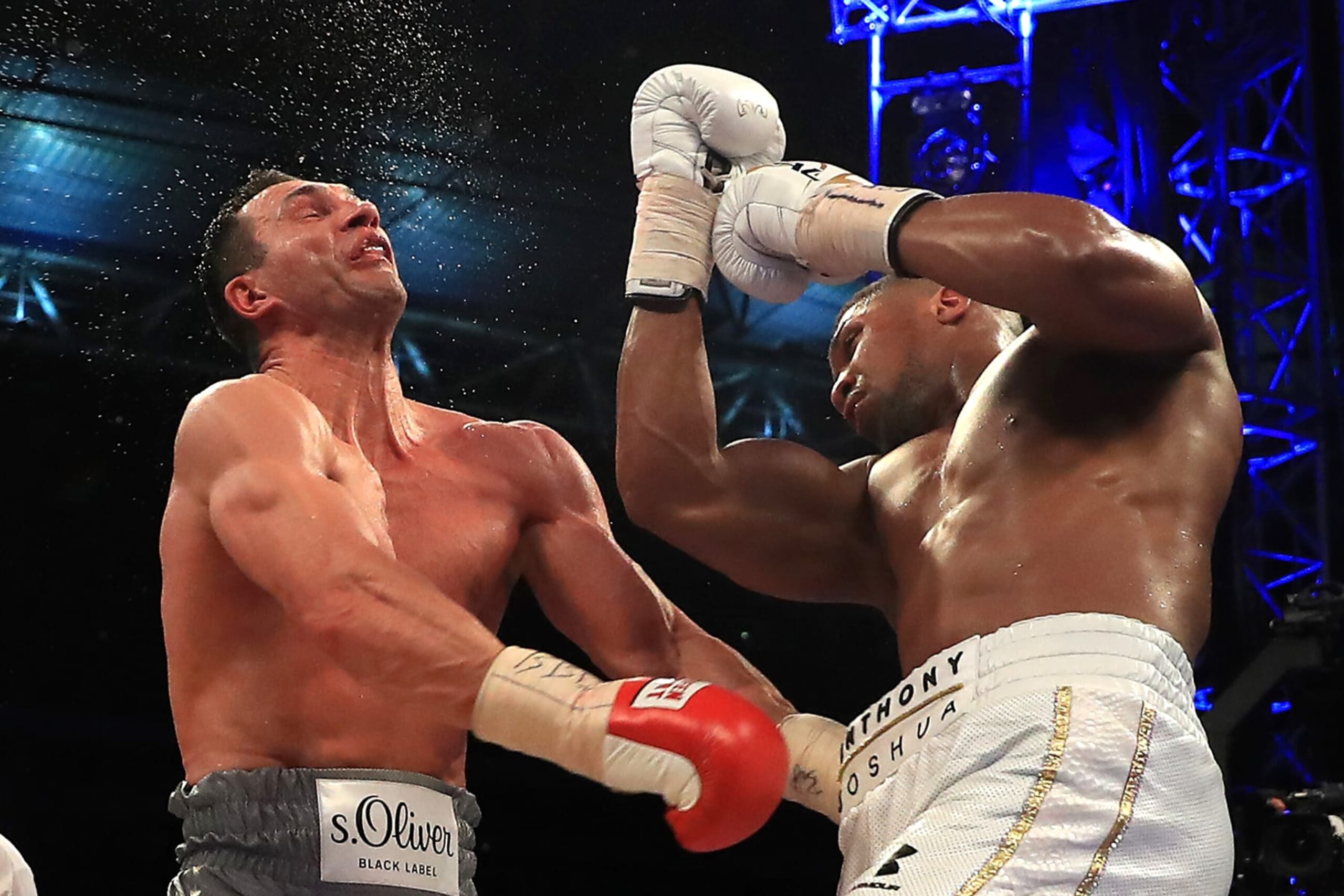LONDON, ENGLAND - APRIL 29: Anthony Joshua (White Shorts) and Wladimir Klitschko (Gray Shorts) in action during the IBF, WBA and IBO Heavyweight World Title bout at Wembley Stadium on April 29, 2017 in London, England. (Photo by Richard Heathcote/Getty Images) LONDON, ENGLAND - APRIL 29: Anthony Joshua (White Shorts) and Wladimir Klitschko (Gray Shorts) in action during the IBF, WBA and IBO Heavyweight World Title bout at Wembley Stadium on April 29, 2017 in London, England. (Photo by Richard Heathcote/Getty Images)