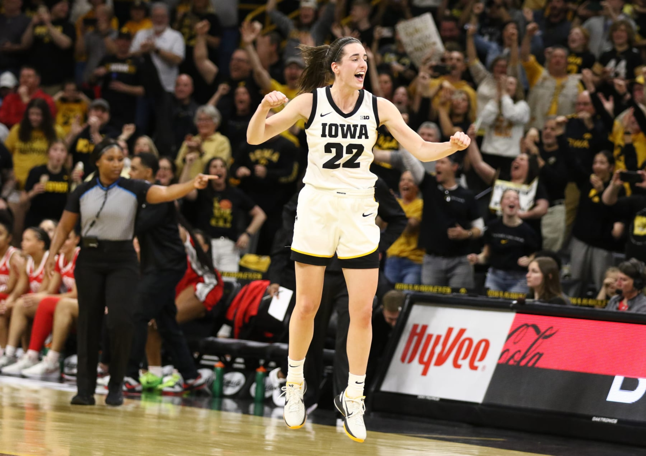 IOWA CITY, IOWA- MARCH 3:  Guard Caitlin Clark #22 of the Iowa Hawkeyes celebrates after breaking Pete Maravich's all-time NCAA scoring record during the first half against the Ohio State Buckeyes at Carver-Hawkeye Arena on March 3, 2024 in Iowa City, Iowa.  (Photo by Matthew Holst/Getty Images)