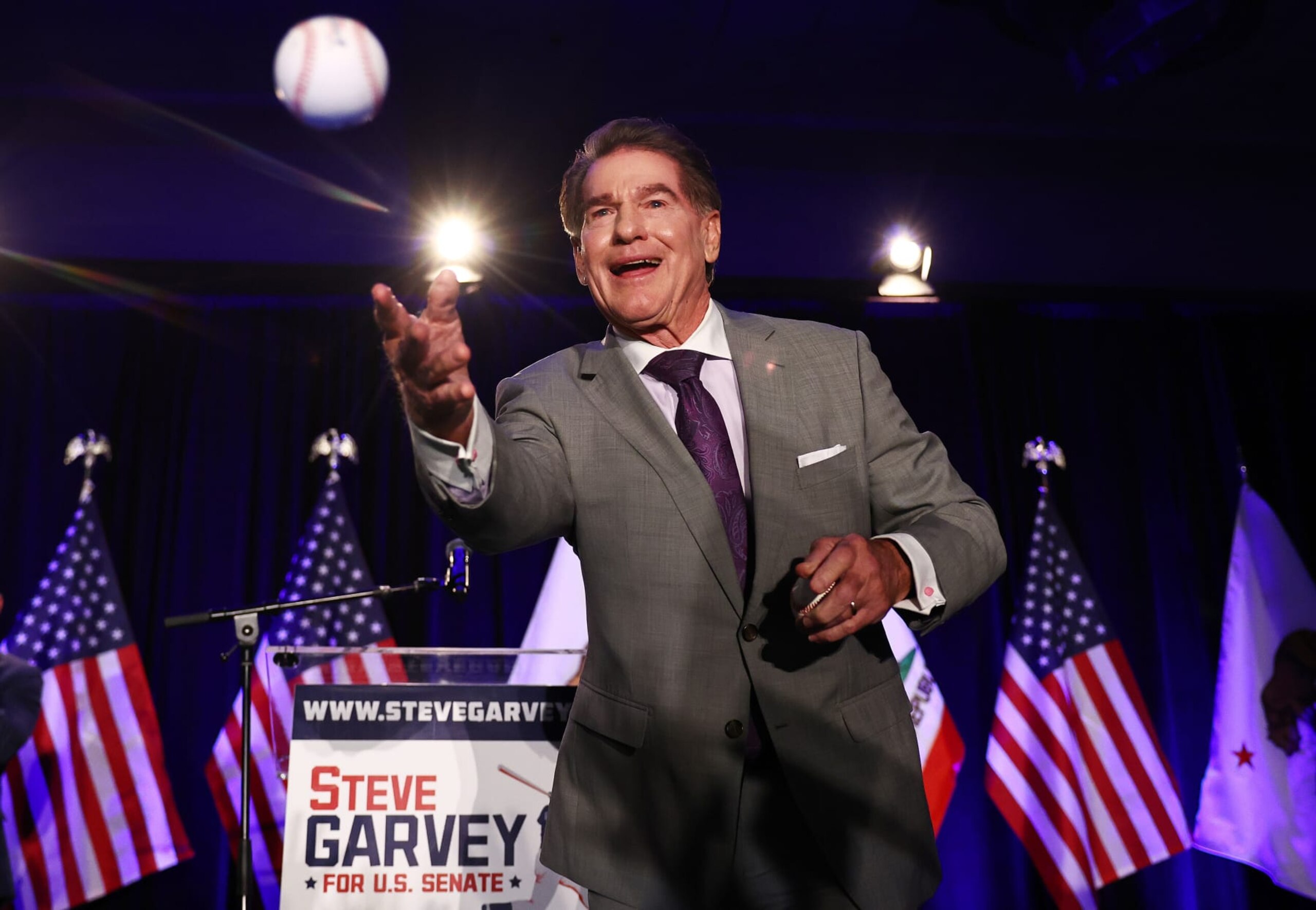 PALM DESERT, CALIFORNIA - MARCH 05: Republican Senate candidate Steve Garvey, a former Los Angeles Dodgers baseball player, tosses a baseball to supporters at his election night watch party on March 5, 2024 in Palm Desert, California. Garvey and Democratic Senate candidate U.S. Rep. Adam Schiff (D-CA) are projected to win the ‘jungle primary’ for a California U.S. Senate seat. Democrats and Republicans are voting in 15 states on Super Tuesday. (Photo by Mario Tama/Getty Images)
