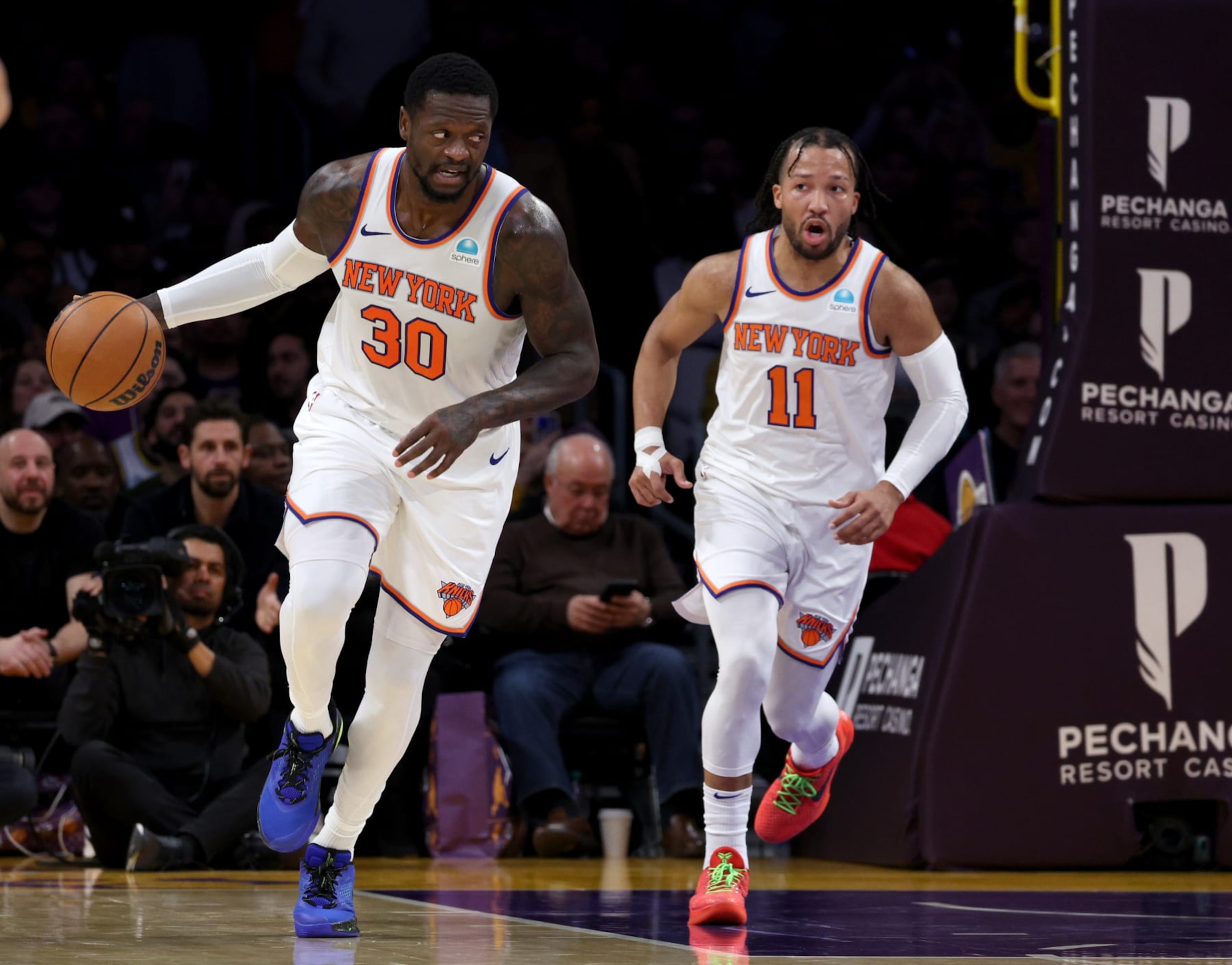 LOS ANGELES, CALIFORNIA - DECEMBER 18: Julius Randle #30 of the New York Knicks brings the ball up court with Jalen Brunson #11 during a 114-109 win over the Los Angeles Lakers at Crypto.com Arena on December 18, 2023 in Los Angeles, California. NOTE TO USER: User expressly acknowledges and agrees that, by downloading and or using this photograph, User is consenting to the terms and conditions of the Getty Images License Agreement. (Photo by Harry How/Getty Images) LOS ANGELES, CALIFORNIA - DECEMBER 18: Julius Randle #30 of the New York Knicks brings the ball up court with Jalen Brunson #11 during a 114-109 win over the Los Angeles Lakers at Crypto.com Arena on December 18, 2023 in Los Angeles, California. NOTE TO USER: User expressly acknowledges and agrees that, by downloading and or using this photograph, User is consenting to the terms and conditions of the Getty Images License Agreement. (Photo by Harry How/Getty Images)