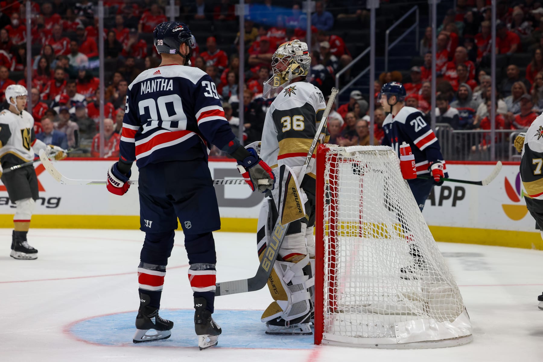 WASHINGTON, DC - NOVEMBER 1: Anthony Mantha #39 of the Washington Capitals and Logan Thompson #36 of the Vegas Golden Knights are face to face after a save during a game at Capital One Arena on November 1, 2022 in Washington, D.C. (Photo by John McCreary/NHLI via Getty Images)
