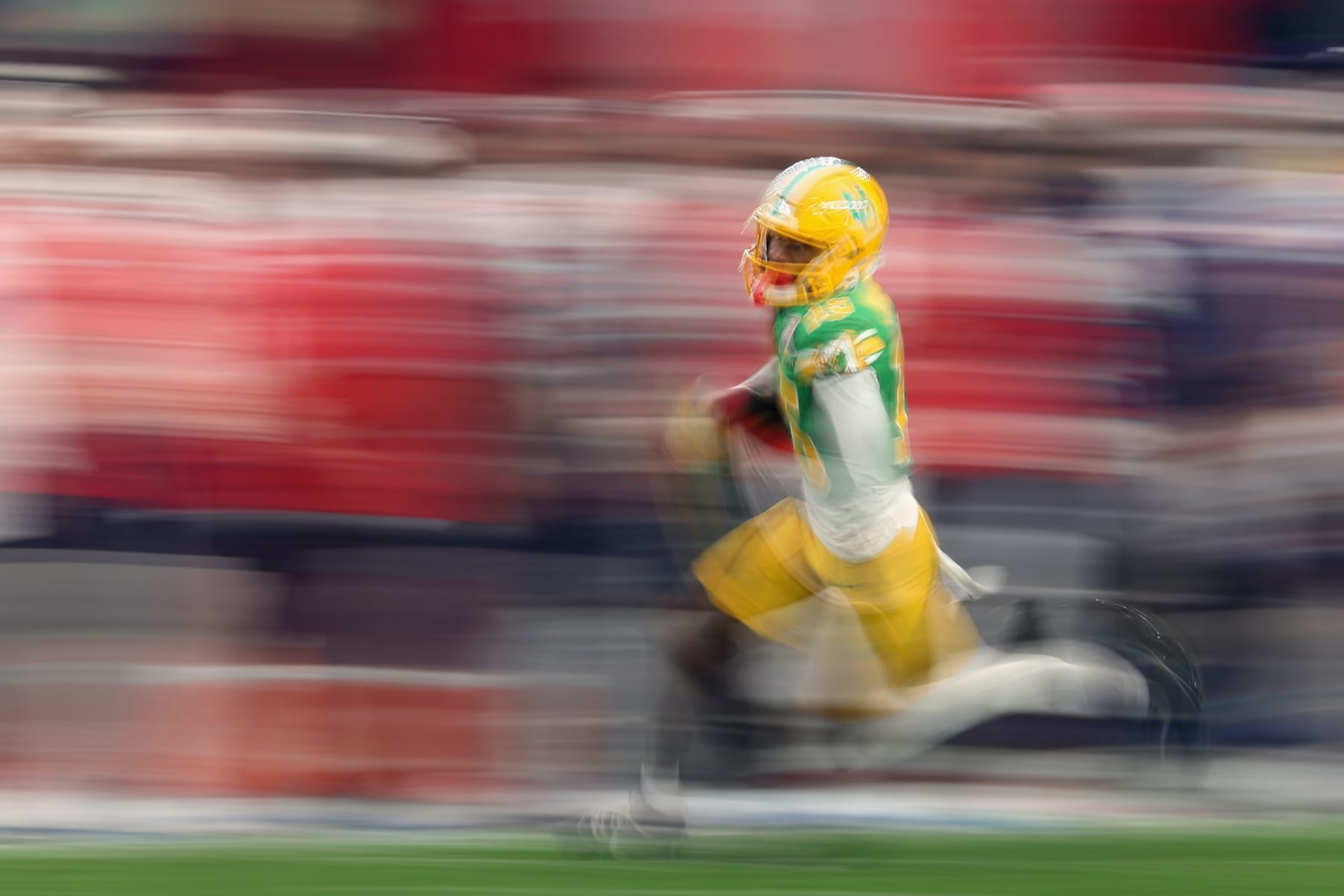 GLENDALE, ARIZONA - JANUARY 01: Wide receiver Tez Johnson #15 of the Oregon Ducks runs with the football after a reception against the Liberty Flames during the first half of the Fiesta Bowl at State Farm Stadium on January 01, 2024 in Glendale, Arizona. (Photo by Christian Petersen/Getty Images) GLENDALE, ARIZONA - JANUARY 01: Wide receiver Tez Johnson #15 of the Oregon Ducks runs with the football after a reception against the Liberty Flames during the first half of the Fiesta Bowl at State Farm Stadium on January 01, 2024 in Glendale, Arizona. (Photo by Christian Petersen/Getty Images)
