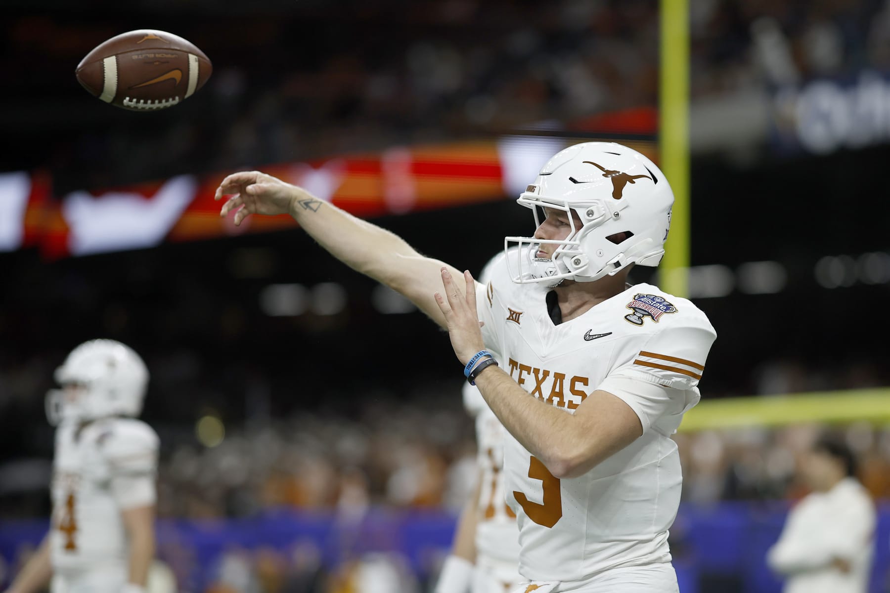 NEW ORLEANS, LOUISIANA - JANUARY 01: Quinn Ewers #3 of the Texas Longhorns warms up prior to playing against the Washington Huskies during the CFP Semifinal Allstate Sugar Bowl at Caesars Superdome on January 01, 2024 in New Orleans, Louisiana. (Photo by Chris Graythen/Getty Images)