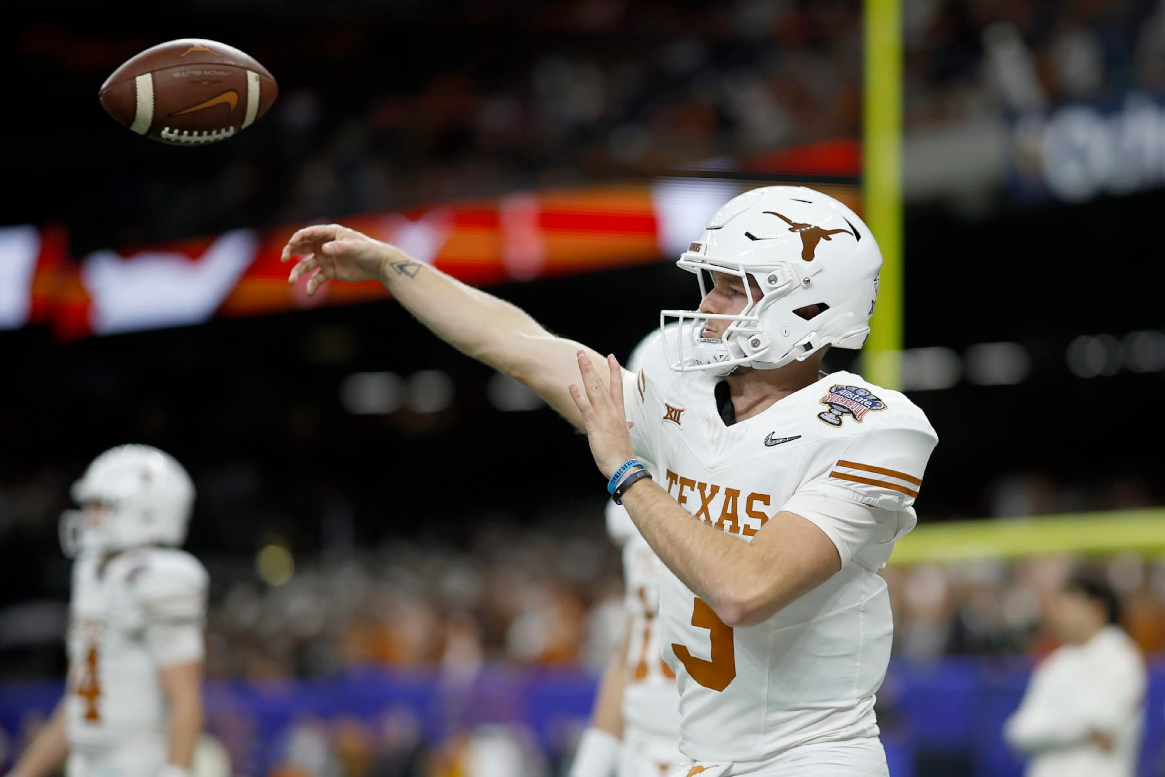 NEW ORLEANS, LOUISIANA - JANUARY 01: Quinn Ewers #3 of the Texas Longhorns warms up prior to playing against the Washington Huskies during the CFP Semifinal Allstate Sugar Bowl at Caesars Superdome on January 01, 2024 in New Orleans, Louisiana. (Photo by Chris Graythen/Getty Images) NEW ORLEANS, LOUISIANA - JANUARY 01: Quinn Ewers #3 of the Texas Longhorns warms up prior to playing against the Washington Huskies during the CFP Semifinal Allstate Sugar Bowl at Caesars Superdome on January 01, 2024 in New Orleans, Louisiana. (Photo by Chris Graythen/Getty Images)