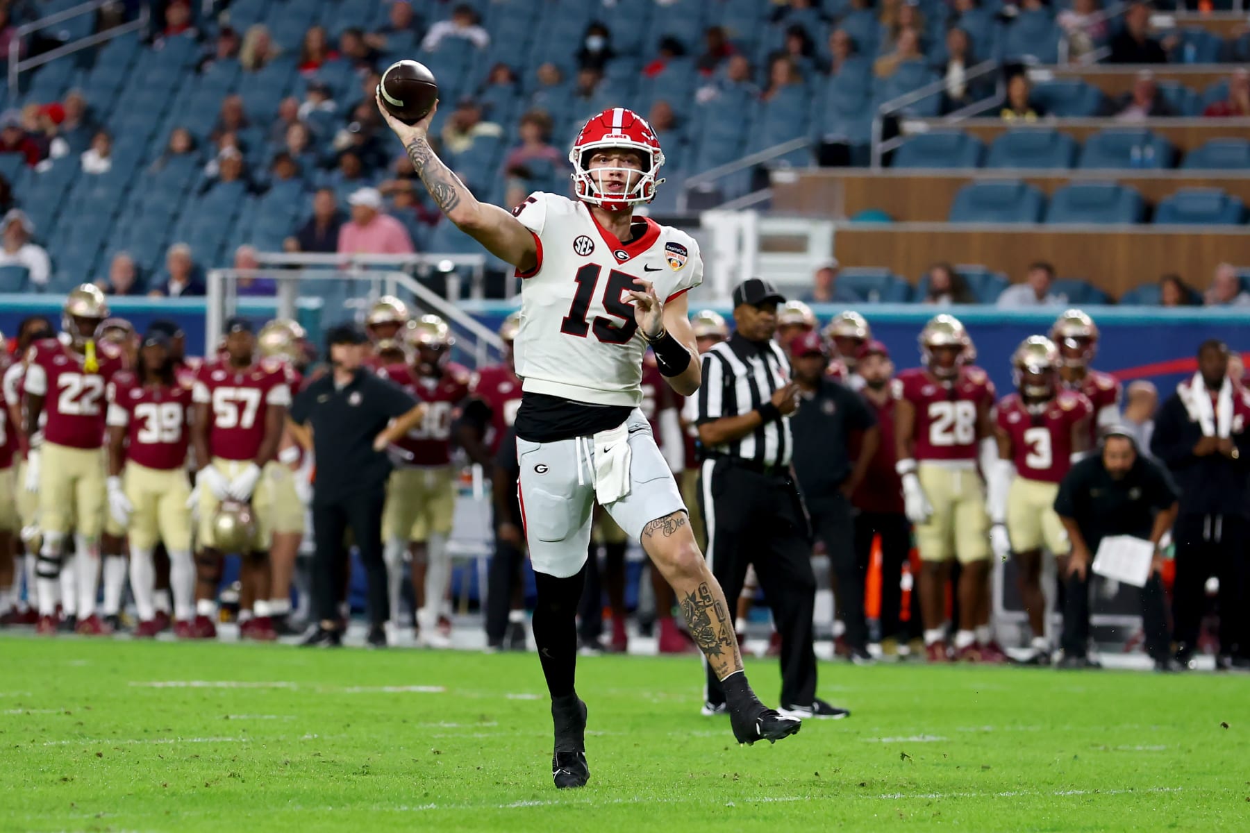 MIAMI GARDENS, FLORIDA - DECEMBER 30: Carson Beck #15 of the Georgia Bulldogs throws a pass in the second quarter against the Florida State Seminoles during the Capital One Orange Bowl at Hard Rock Stadium on December 30, 2023 in Miami Gardens, Florida. (Photo by Megan Briggs/Getty Images)