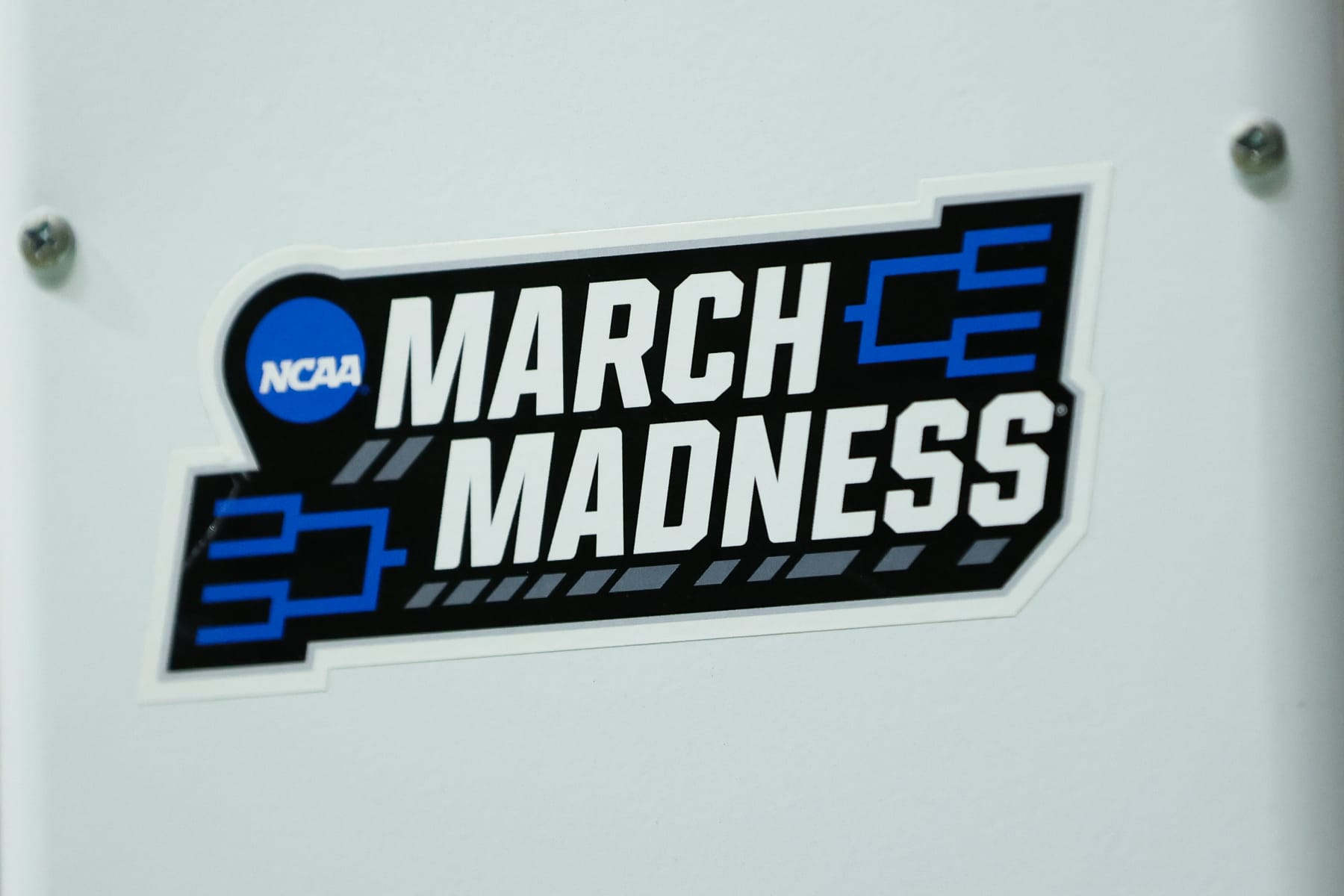 CHARLOTTE, NORTH CAROLINA - JANUARY 6: The March Madness logo is shown on a ball rack before the Florida Atlantic Owls take on the Charlotte 49ers at Dale F. Halton Arena on January 6, 2024 in Charlotte, North Carolina. (Photo by Isaiah Vazquez/Getty Images)