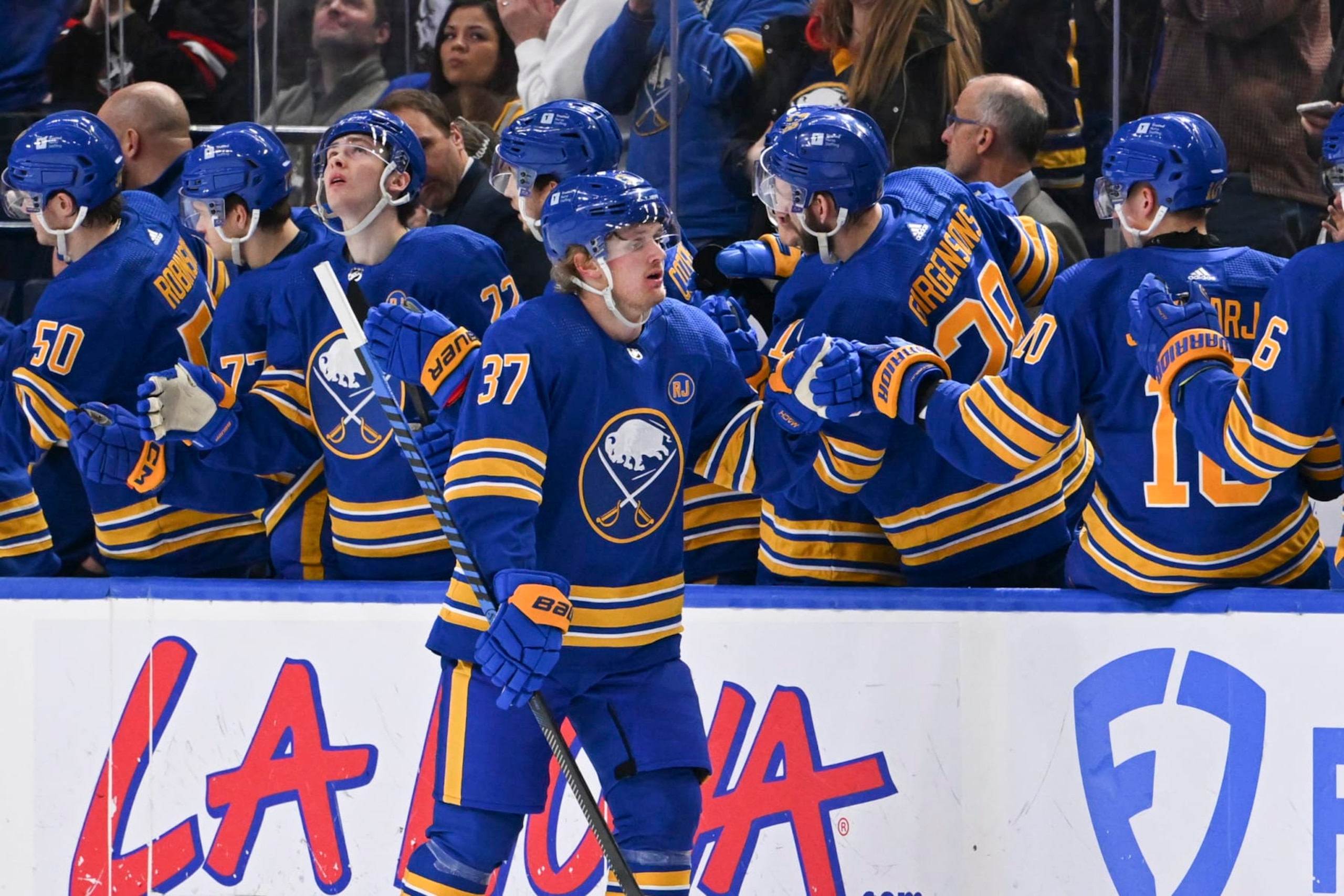BUFFALO, NEW YORK - JANUARY 15: Casey Mittelstadt #37 of the Buffalo Sabres celebrates his second period goal with teammates on the bench during an NHL game against the San Jose Sharks on January 15, 2024 at KeyBank Center in Buffalo, New York. (Photo by Joe Hrycych/NHLI via Getty Images)