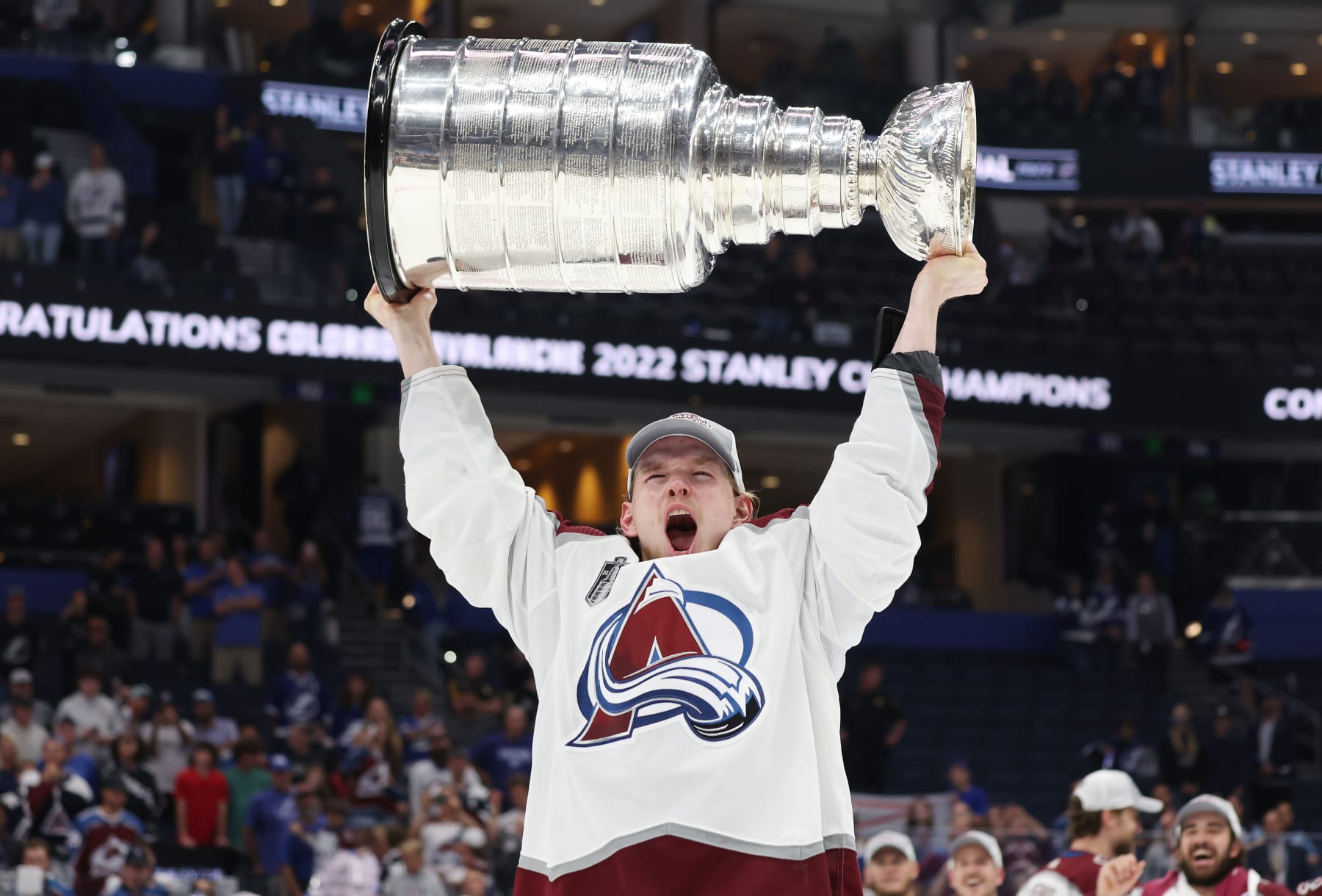 TAMPA, FLORIDA - JUNE 26: Bowen Byram #4 of the Colorado Avalanche lifts the Stanley Cup after defeating the Tampa Bay Lightning 2-1 in Game Six of the 2022 NHL Stanley Cup Final at Amalie Arena on June 26, 2022 in Tampa, Florida. (Photo by Christian Petersen/Getty Images)