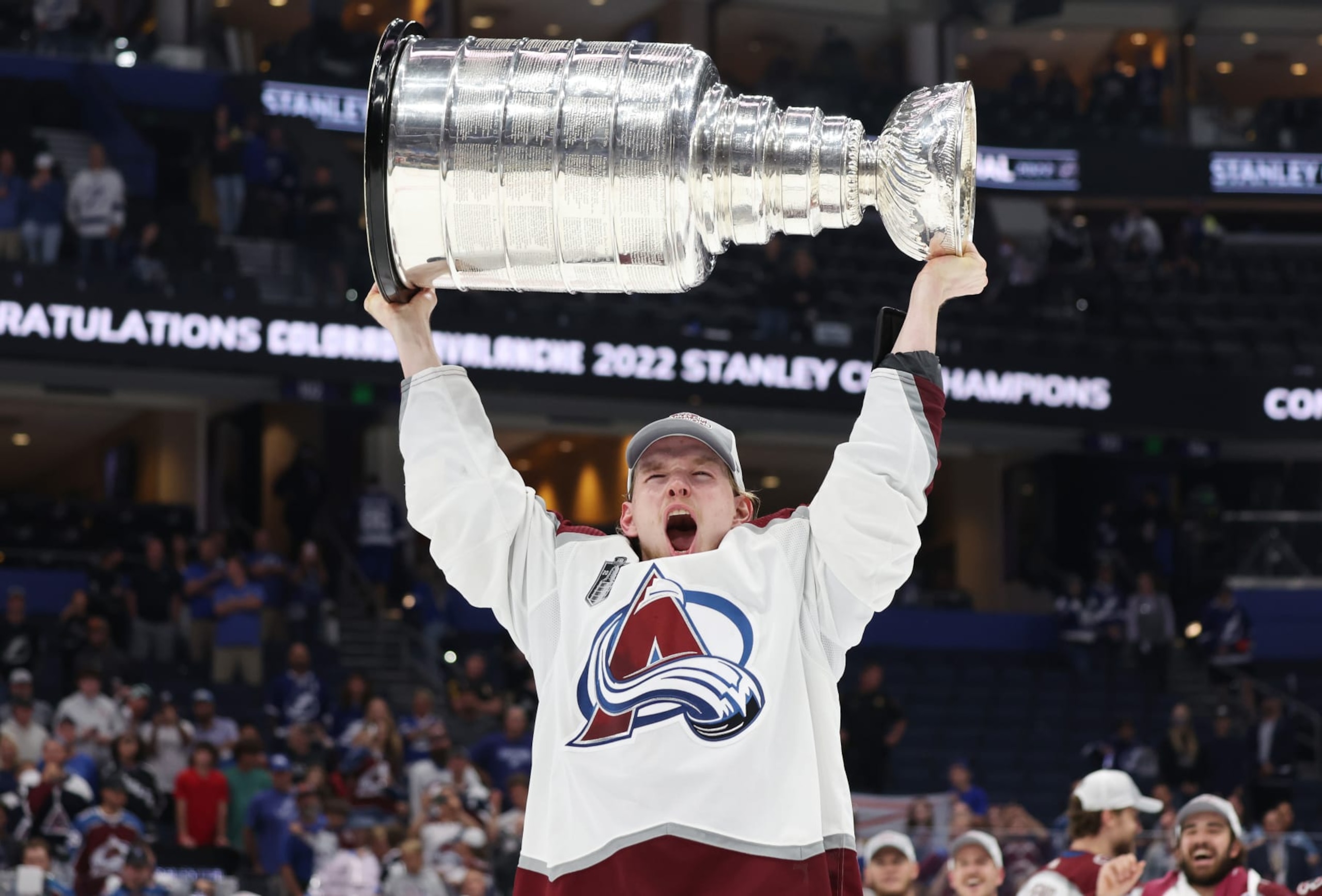 TAMPA, FLORIDA - JUNE 26: Bowen Byram #4 of the Colorado Avalanche lifts the Stanley Cup after defeating the Tampa Bay Lightning 2-1 in Game Six of the 2022 NHL Stanley Cup Final at Amalie Arena on June 26, 2022 in Tampa, Florida. (Photo by Christian Petersen/Getty Images) TAMPA, FLORIDA - JUNE 26: Bowen Byram #4 of the Colorado Avalanche lifts the Stanley Cup after defeating the Tampa Bay Lightning 2-1 in Game Six of the 2022 NHL Stanley Cup Final at Amalie Arena on June 26, 2022 in Tampa, Florida. (Photo by Christian Petersen/Getty Images)