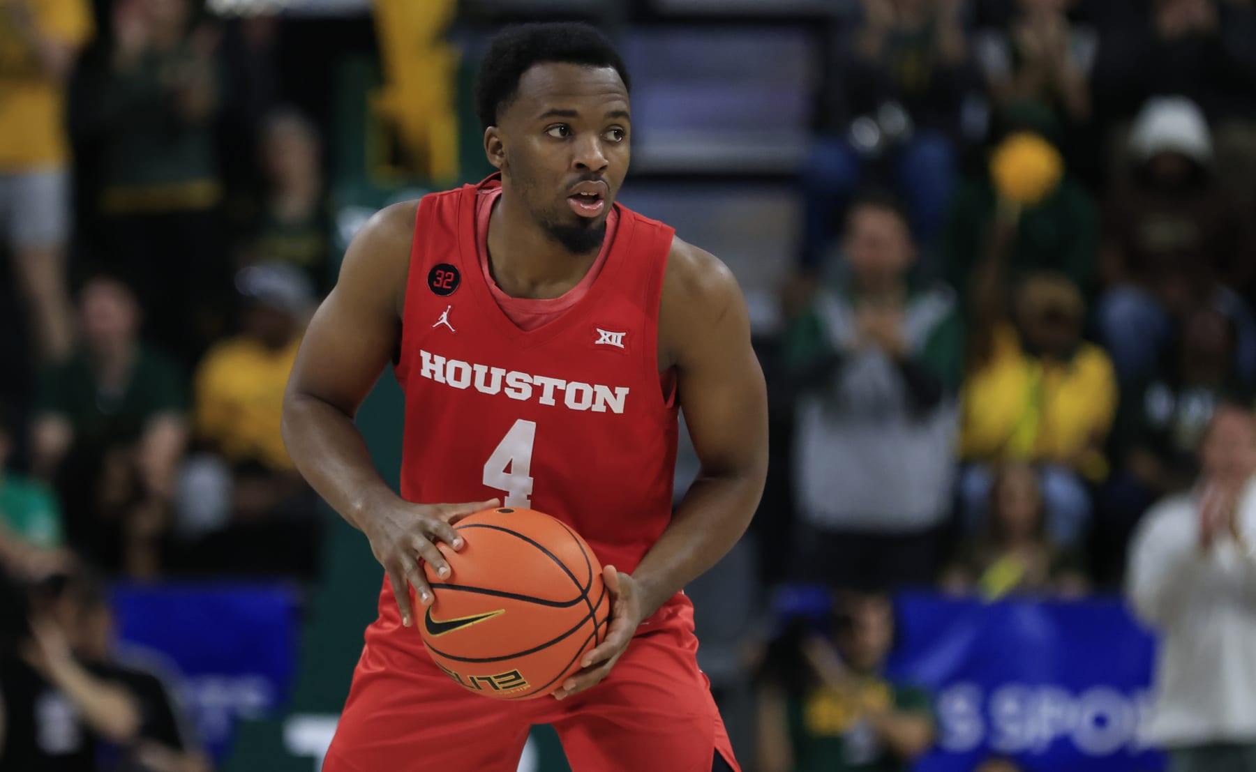 WACO, TX - FEBRUARY 24: L.J. Cryer #4 of the Houston Cougars handles the ball against the Baylor Bears in the second half at Foster Pavilion on February 24, 2024 in Waco, Texas. (Photo by Ron Jenkins/Getty Images)