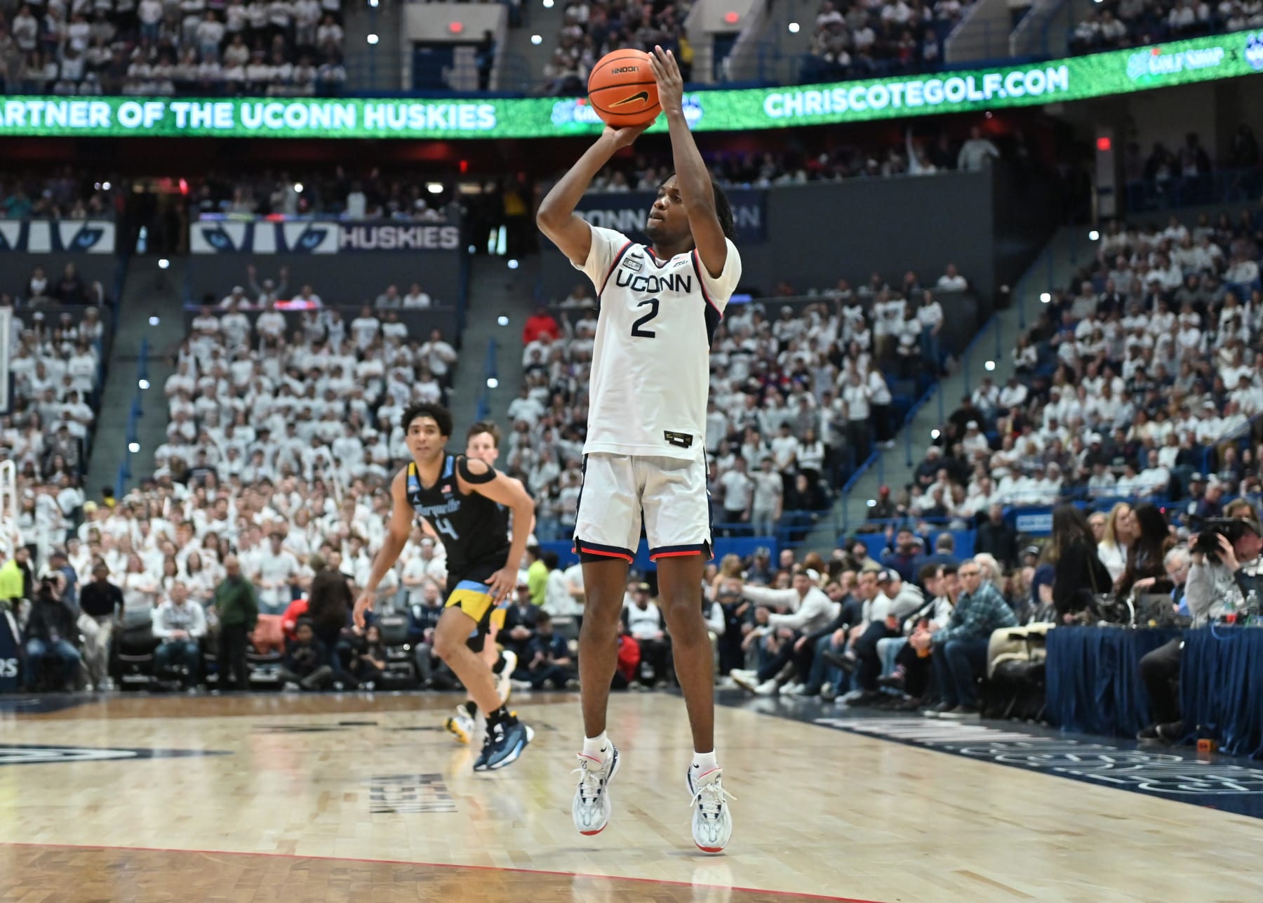 HARTFORD, CT - FEBRUARY 17: UConn Huskies guard Tristen Newton (2) shoots the three point shot during the game as the Marquette Golden Eagles take on the UConn Huskies on February 17, 2024 at the XL Center in Hartford, CT (Photo by Williams Paul/Icon Sportswire via Getty Images)